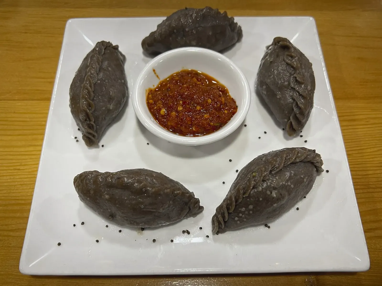 Hoentay by Mr. Wanderer Hoentay placed in orbit around dipping bowl all on a plate.