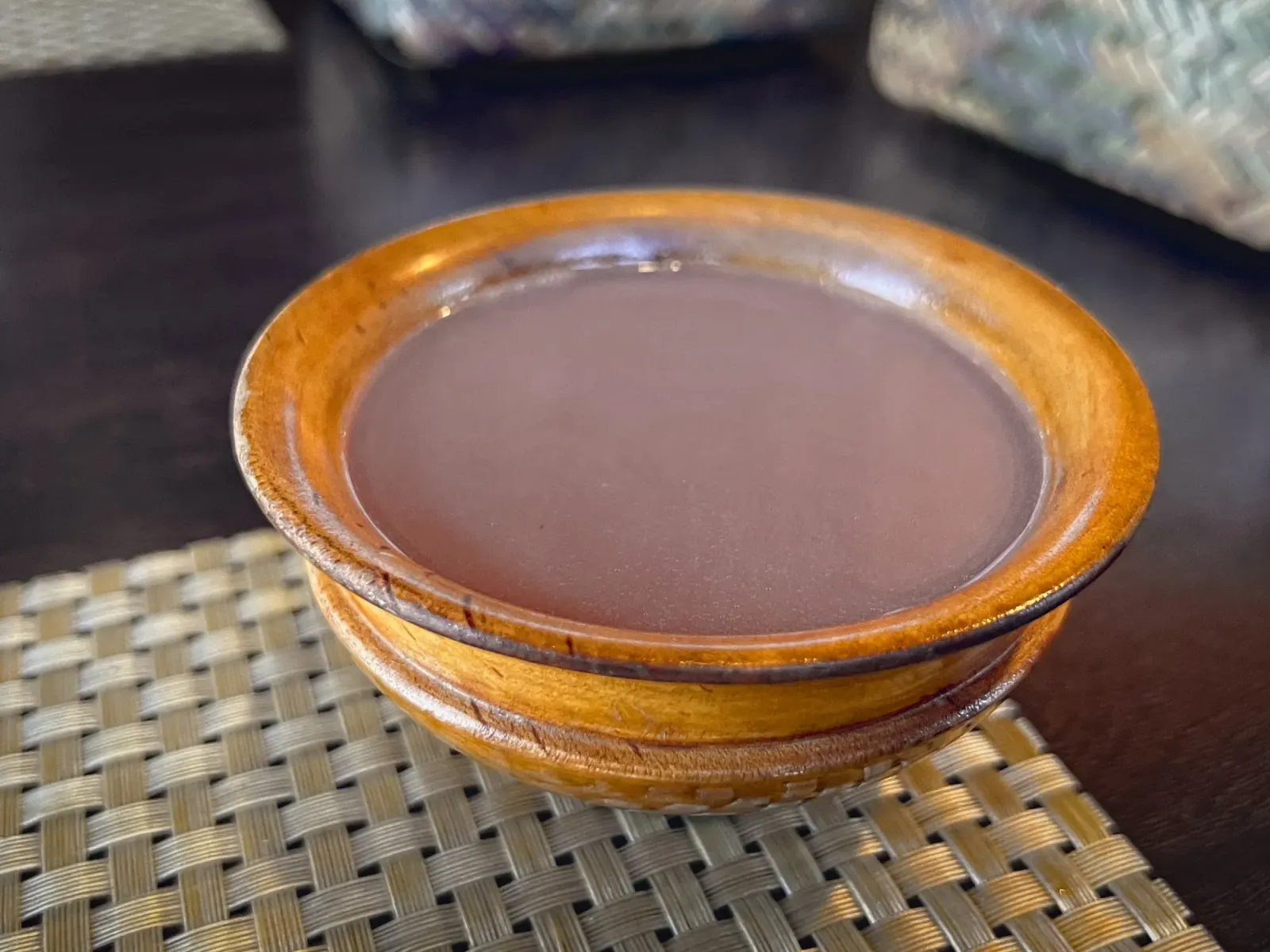 Suja by Mr. Wanderer Suja in a small wooden cup-bowl, angled shot.