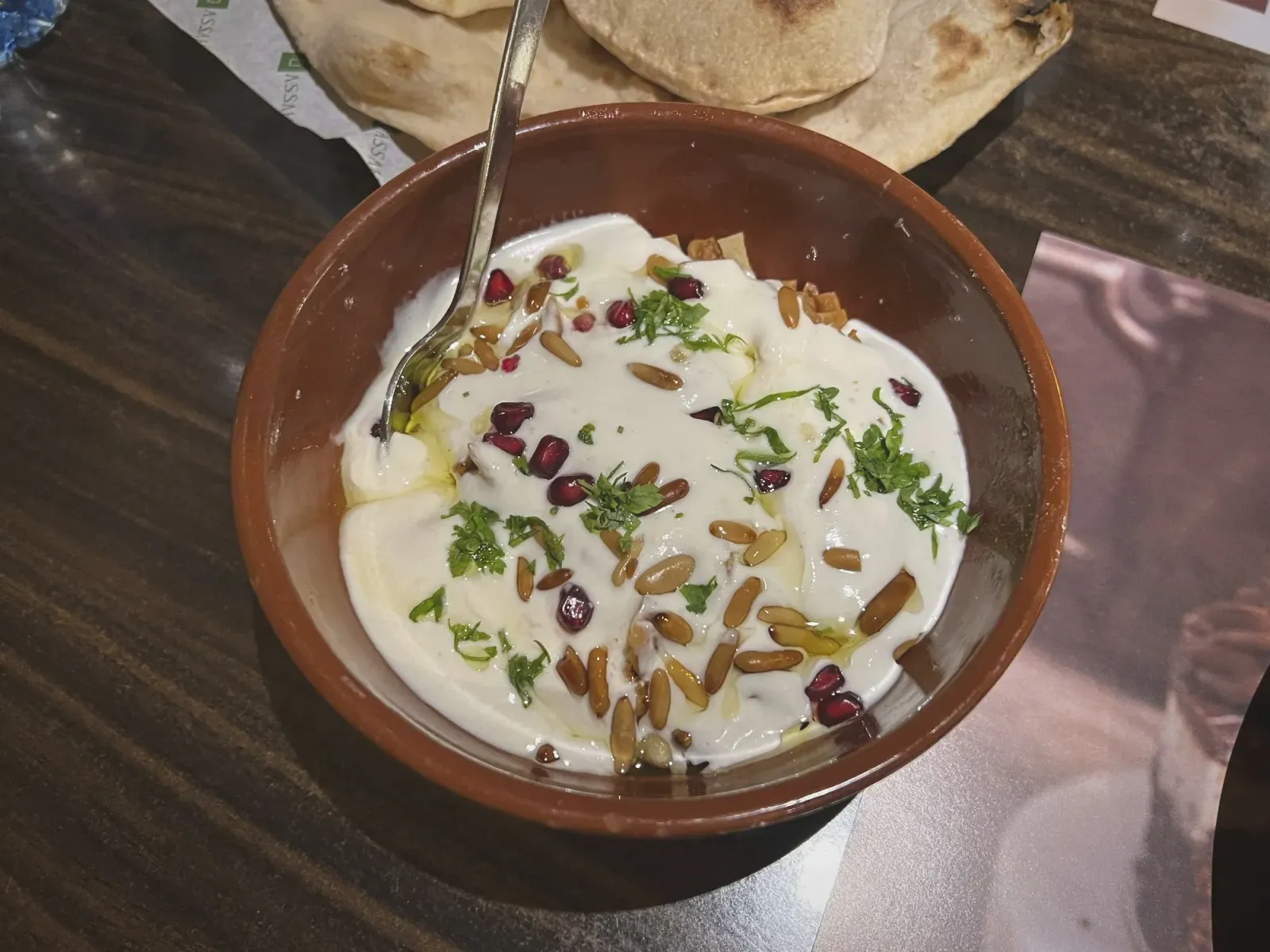 Levant Fateeh by Mr. Wanderer Fatteh in a bowl with bread in the background.