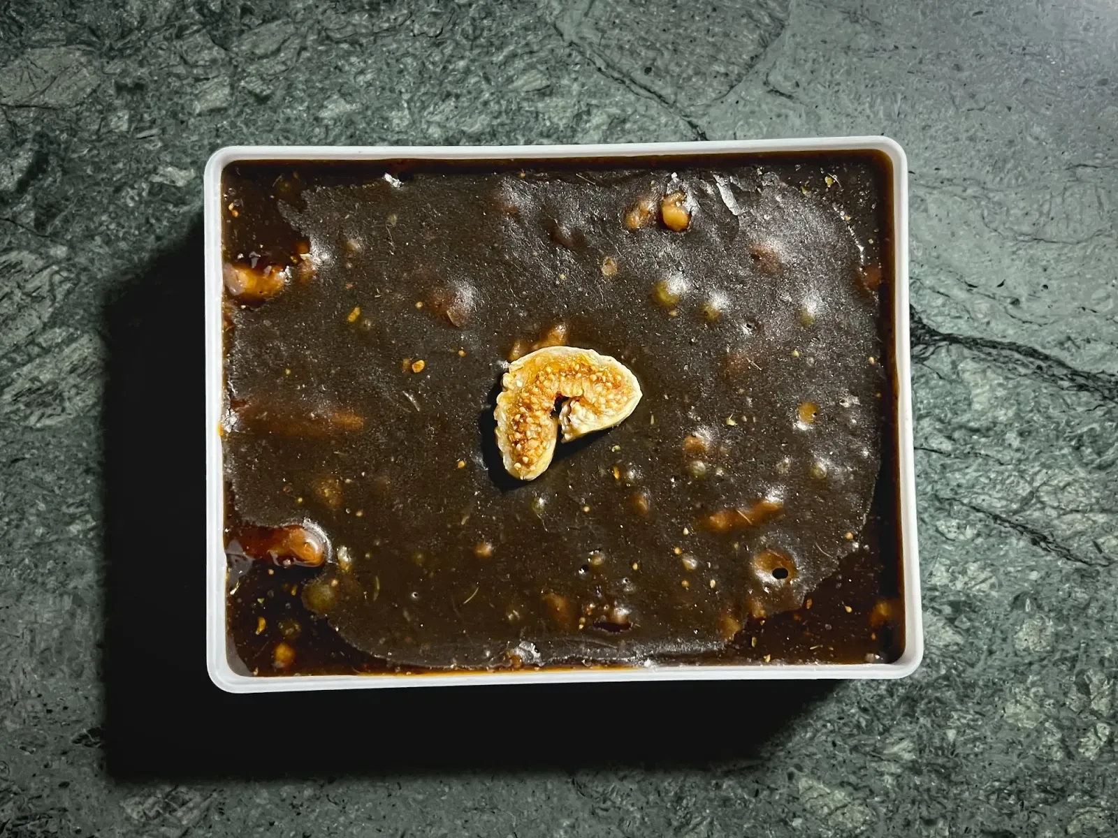 Omani Halwa by Mr. Wanderer Omani Halwa with a cut fig in the middle, overhead shot.