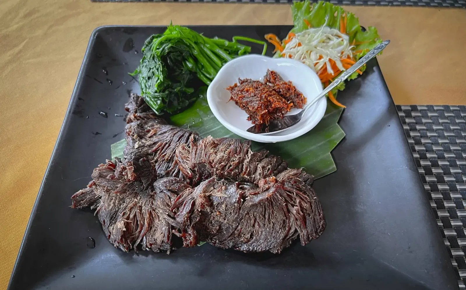 Lao Beef Jerkey by Mr. Wanderer Lao beef jerkey with a side of Jaew Bong.