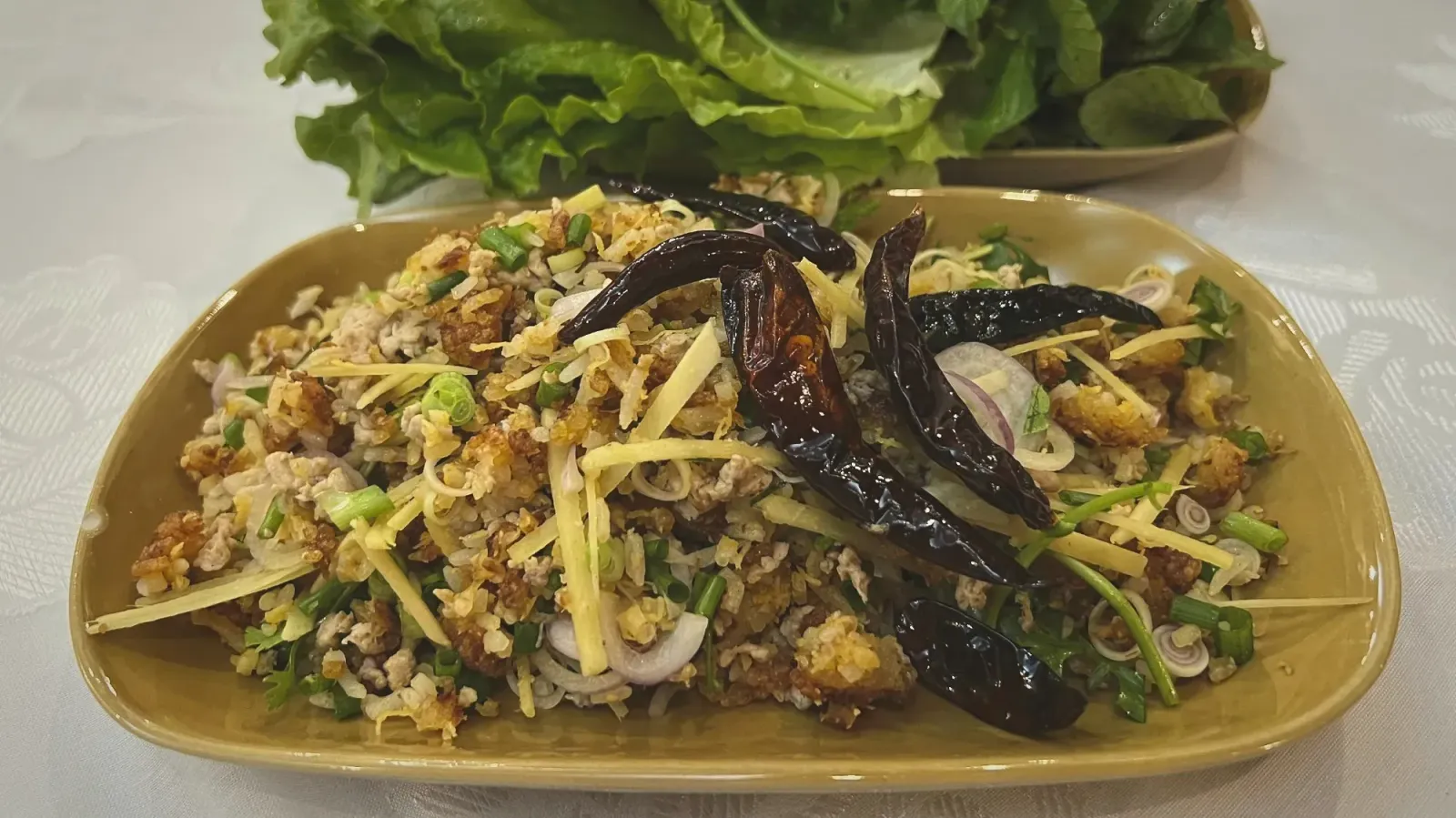 Naem Khao Tod by Mr. Wanderer Naem Khao Tod (Crispy Rice Salad).