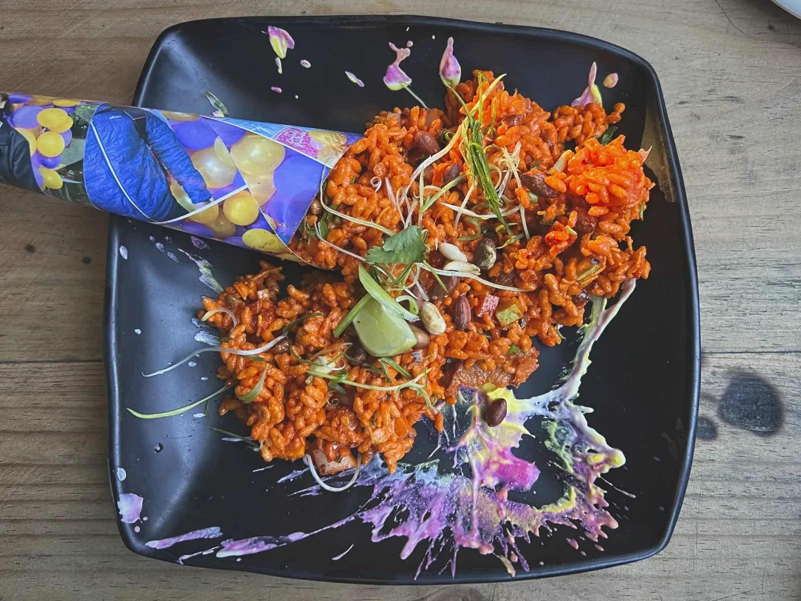 Chatpate by Mr. Wanderer Overhead shot of artistic Chatpate on a plate with paint splattered sauce.