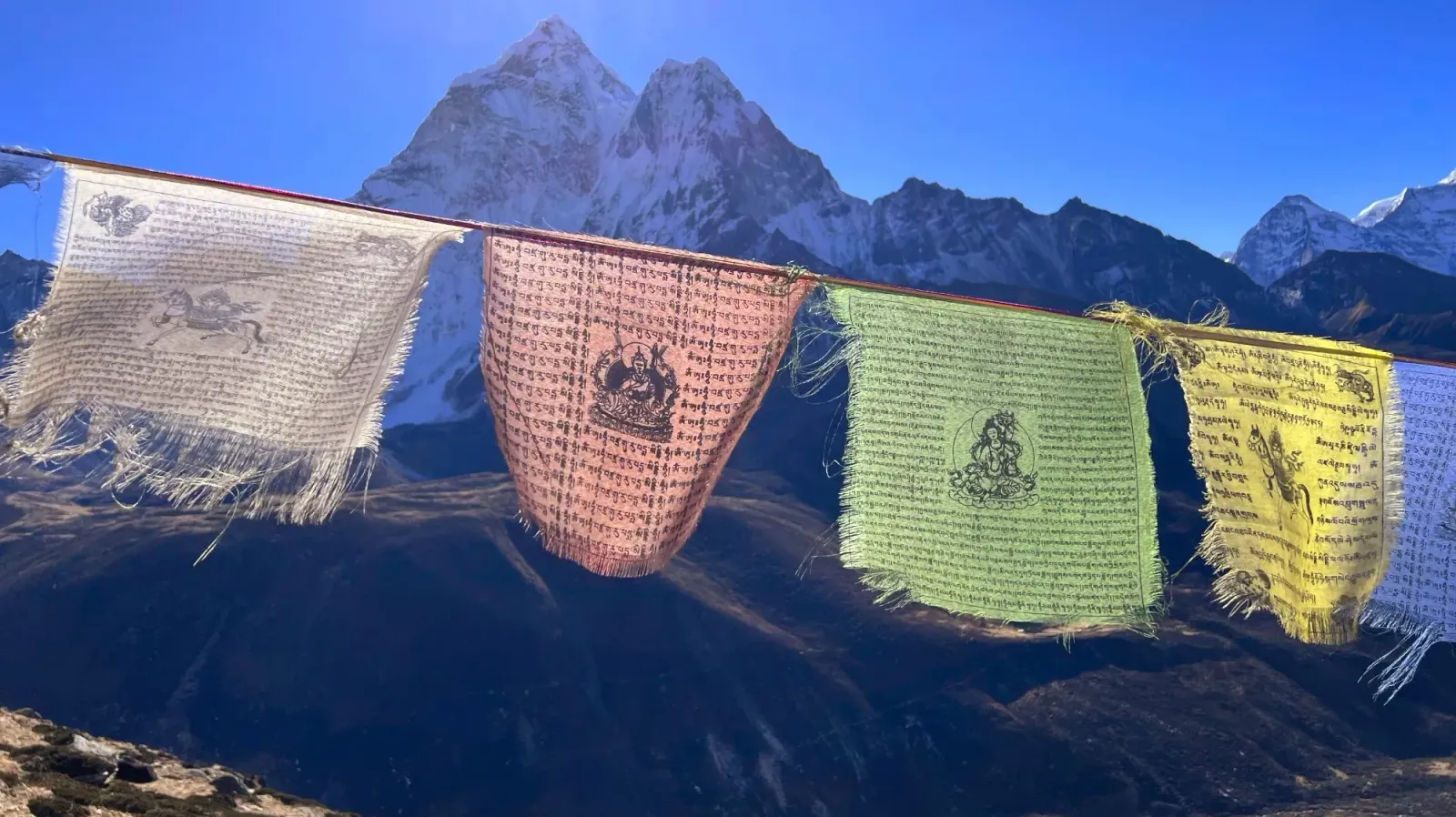 Weathered Prayer Flags by Mr. Wanderer Worn white, red, green, and yellow prayer flags hanging
