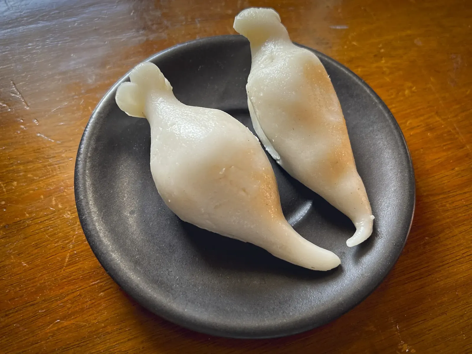 Yomari by Mr. Wanderer Angled shot of two Yomari.