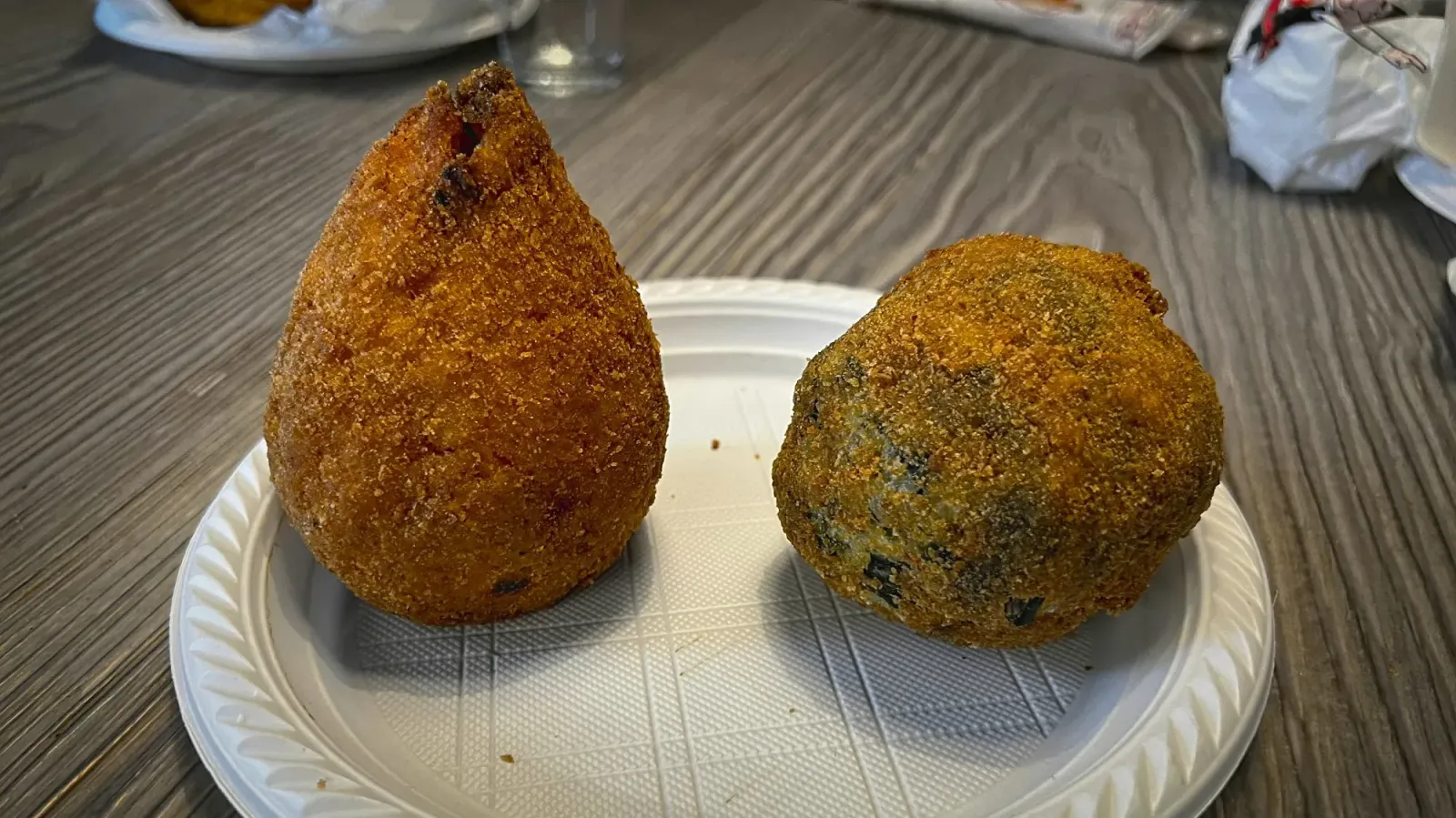 Arancini by Mr. Wanderer Arancini. Low angle shot on a plate.