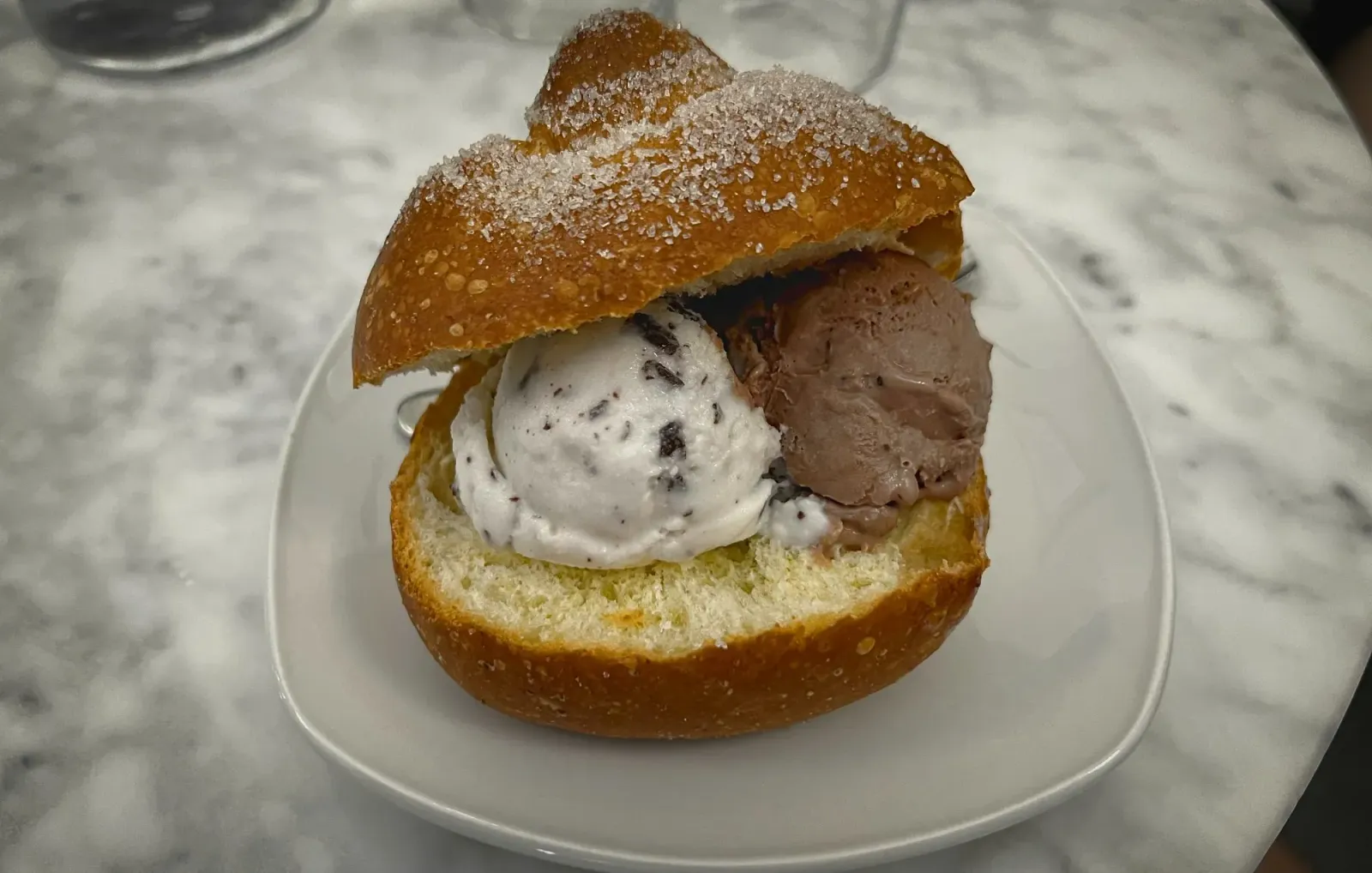 Brioche con Gelato by Mr. Wanderer Brioche con Gelato from Cafe Sicilia in Noto. Low angle shot.