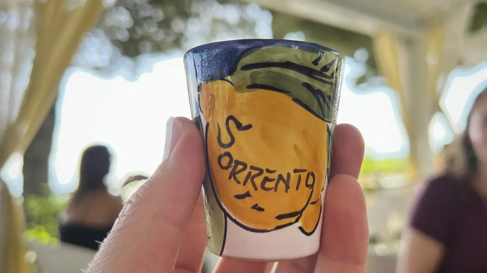 Limoncello by Mr. Wanderer Glass of Limoncello from Sorrento Excellence. Straight shot with cute patio in the background.
