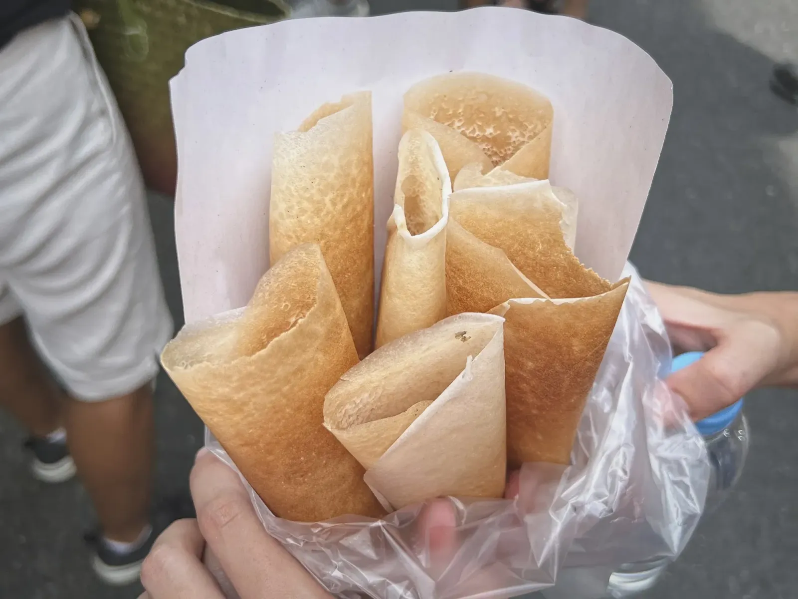 Thai coconut crepes by Mr. Wanderer A plastic bag full of coconut crepes.