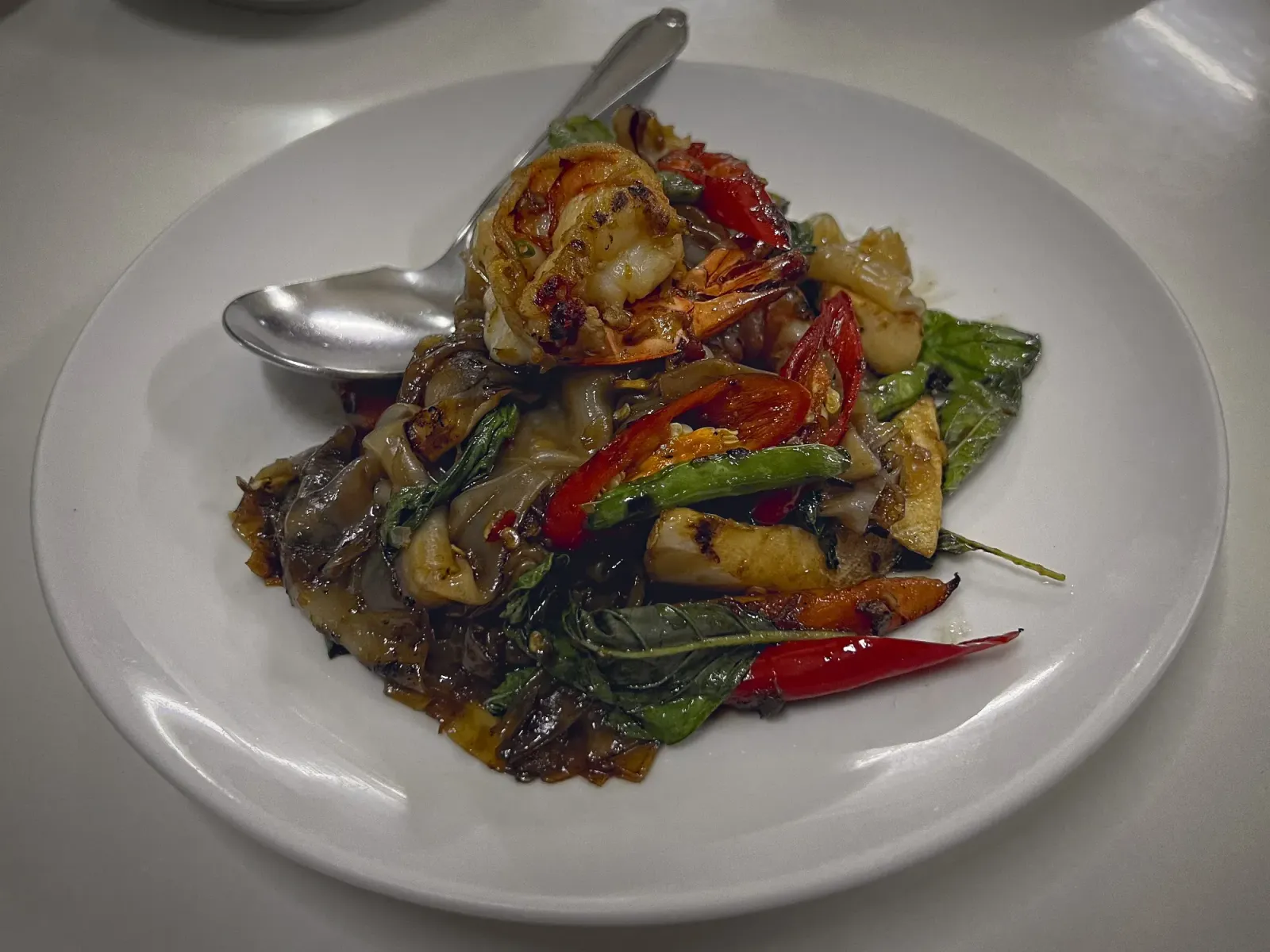 Drunken Noodles by Mr. Wanderer Angled shot of Drunken Noodles on a plate.