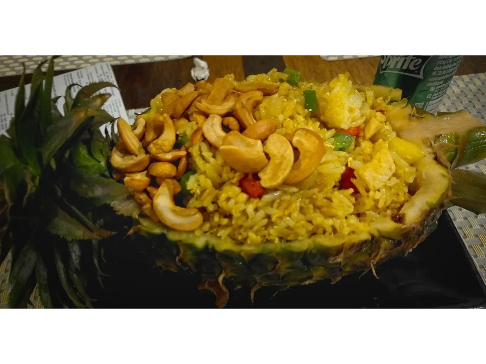 Thai cashew chicken by Mr. Wanderer Thai cashew chicken inside of a hollowed out pineapple.