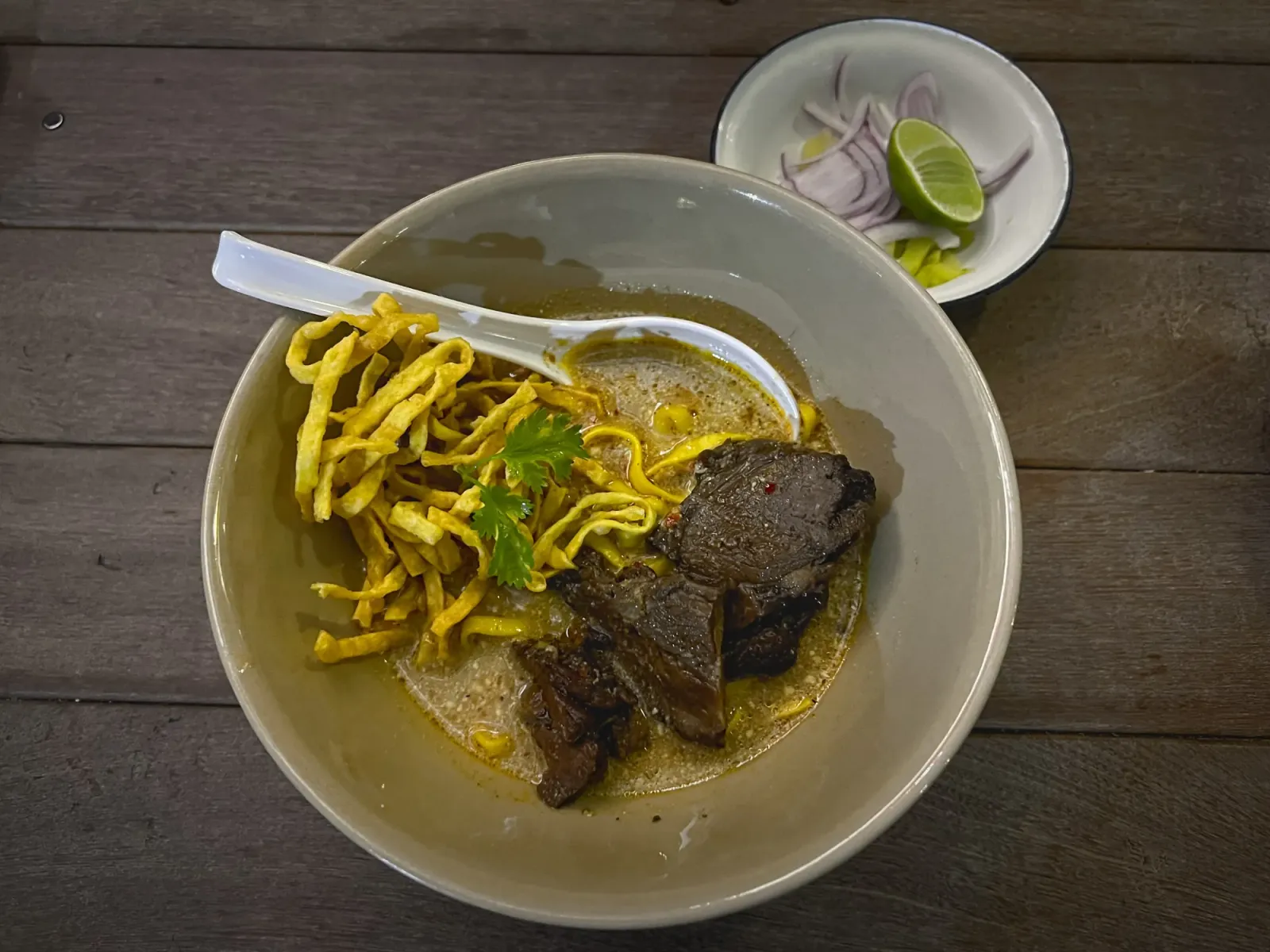 Khao Soi by Mr. Wanderer Bowl of Khao Soi, overhead shot.