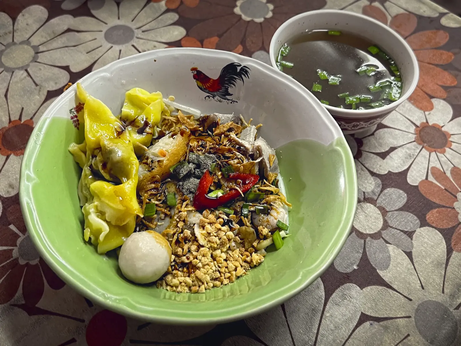 Mee Sapam by Mr. Wanderer Mee Sapam in a bowl with a side of broth.