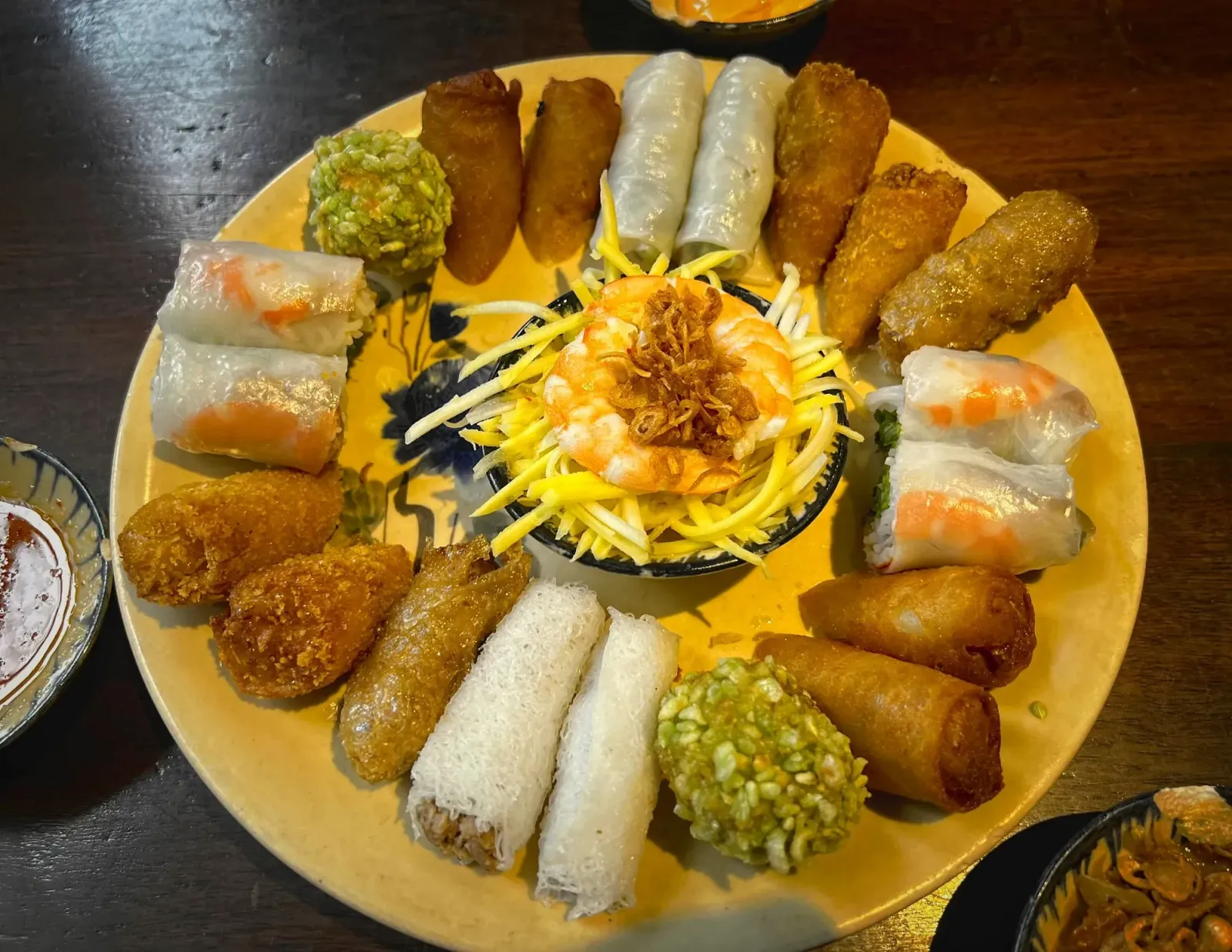 Vietnamese Spring Rolls by Mr. Wanderer A platter of different Vietnamese spring rolls, overhead shot.