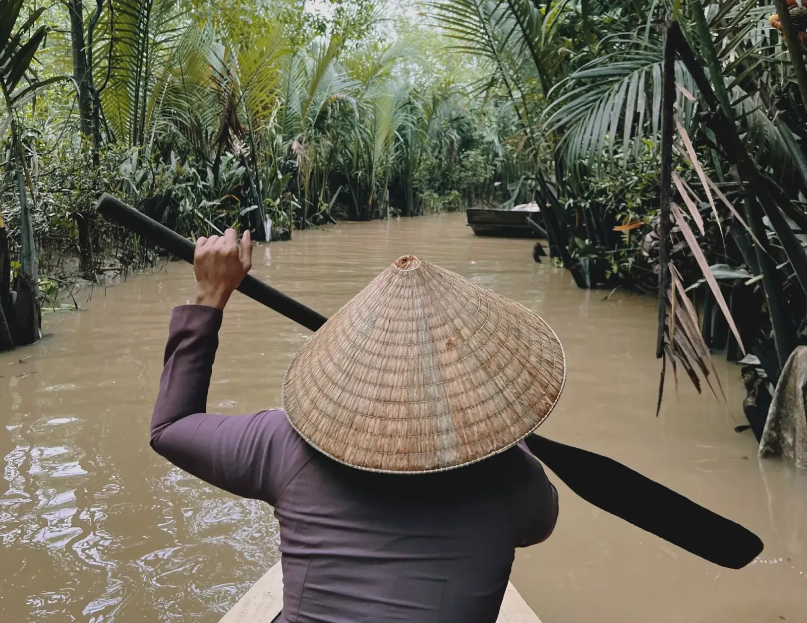 Mekong Delta by Mr. Wanderer Paddling through the Mekong delta on small boat.