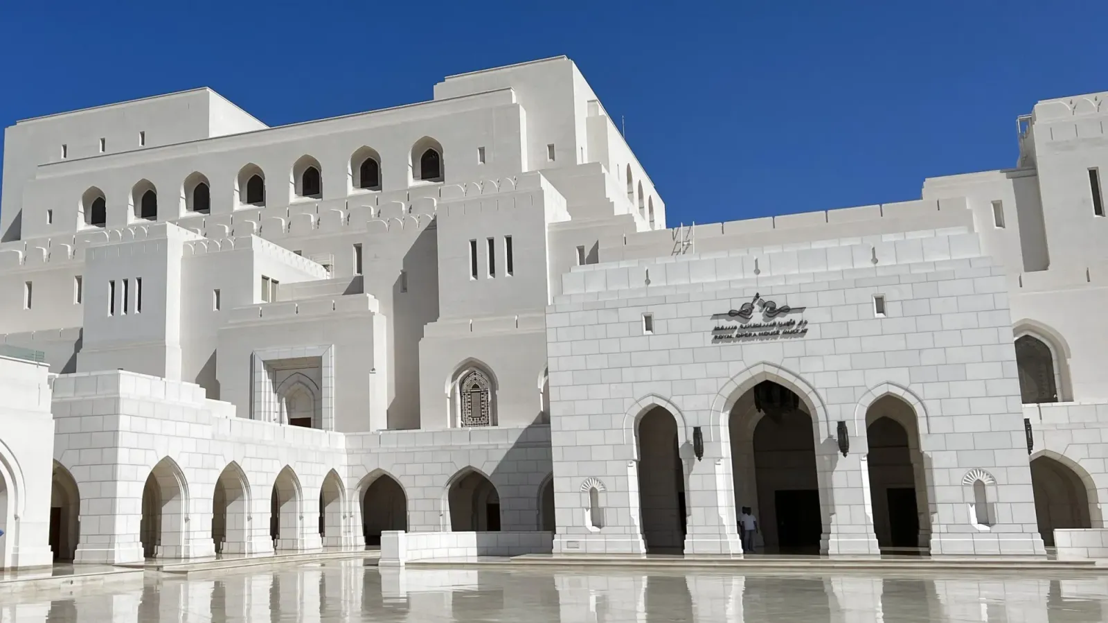 Royal Opera House by Mrs. Wanderer White stone building with multiple faces over marble courtyard
