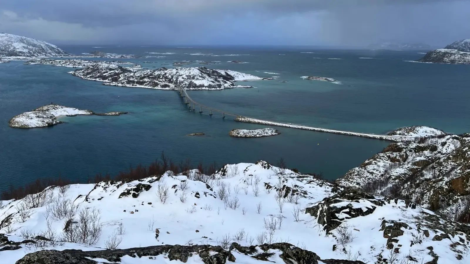 Sommarøy by Mrs. Wanderer View of snowy hills overlooking the bridge connecting to Sommarøy island