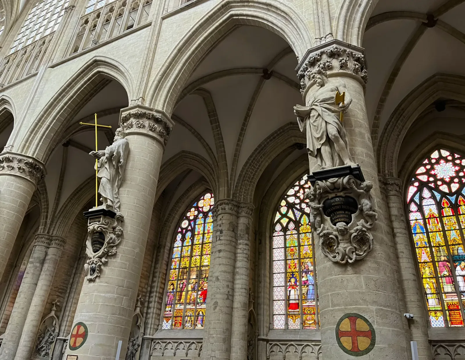 Belgian Churches by Mr.Wanderer Grey stone columns with statues of saints on them