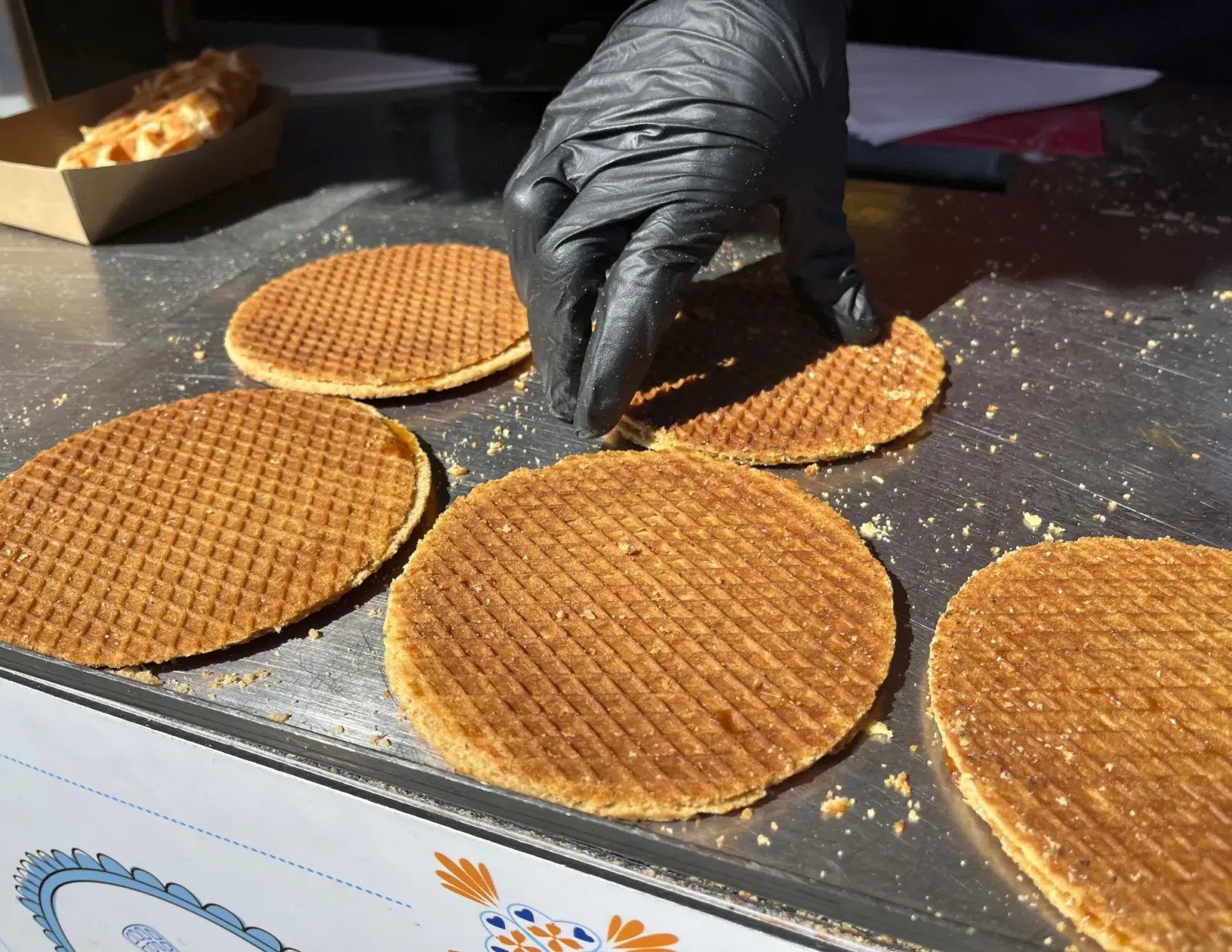 Stroopwafels by Mrs.Wanderer Flat Dutch waffles being served by a gloved hand