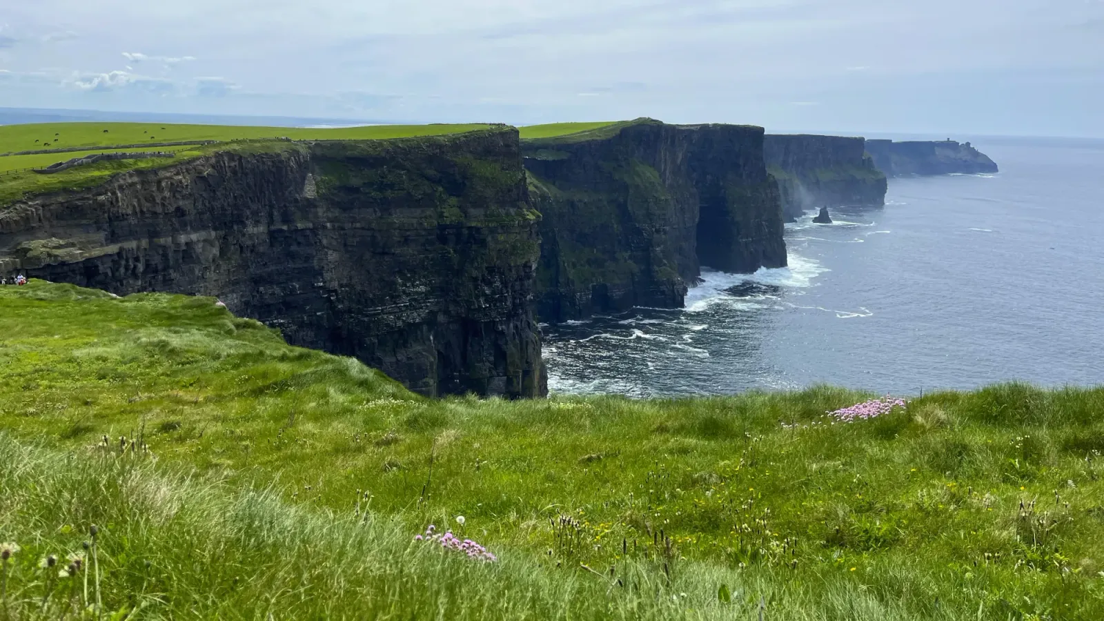 Cliffs of Moher by Mrs.Wanderer Curved cliffs with sharp drop-off into the ocean