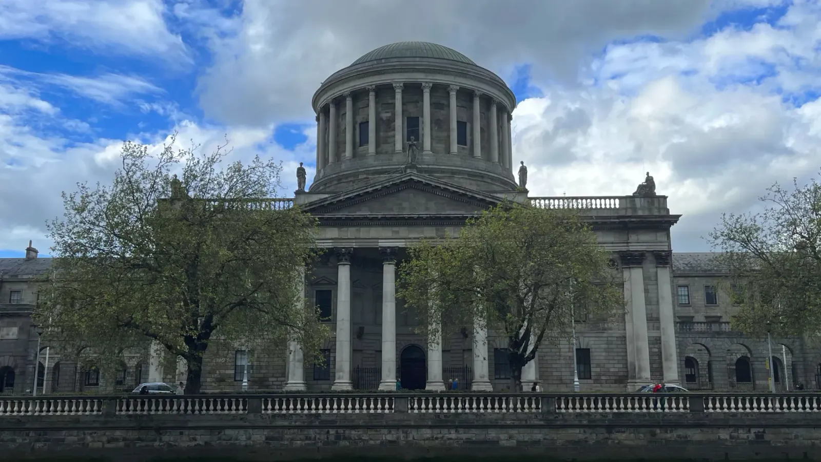 Four Courts by Mrs. Wanderer Columned building with trees in the foreground