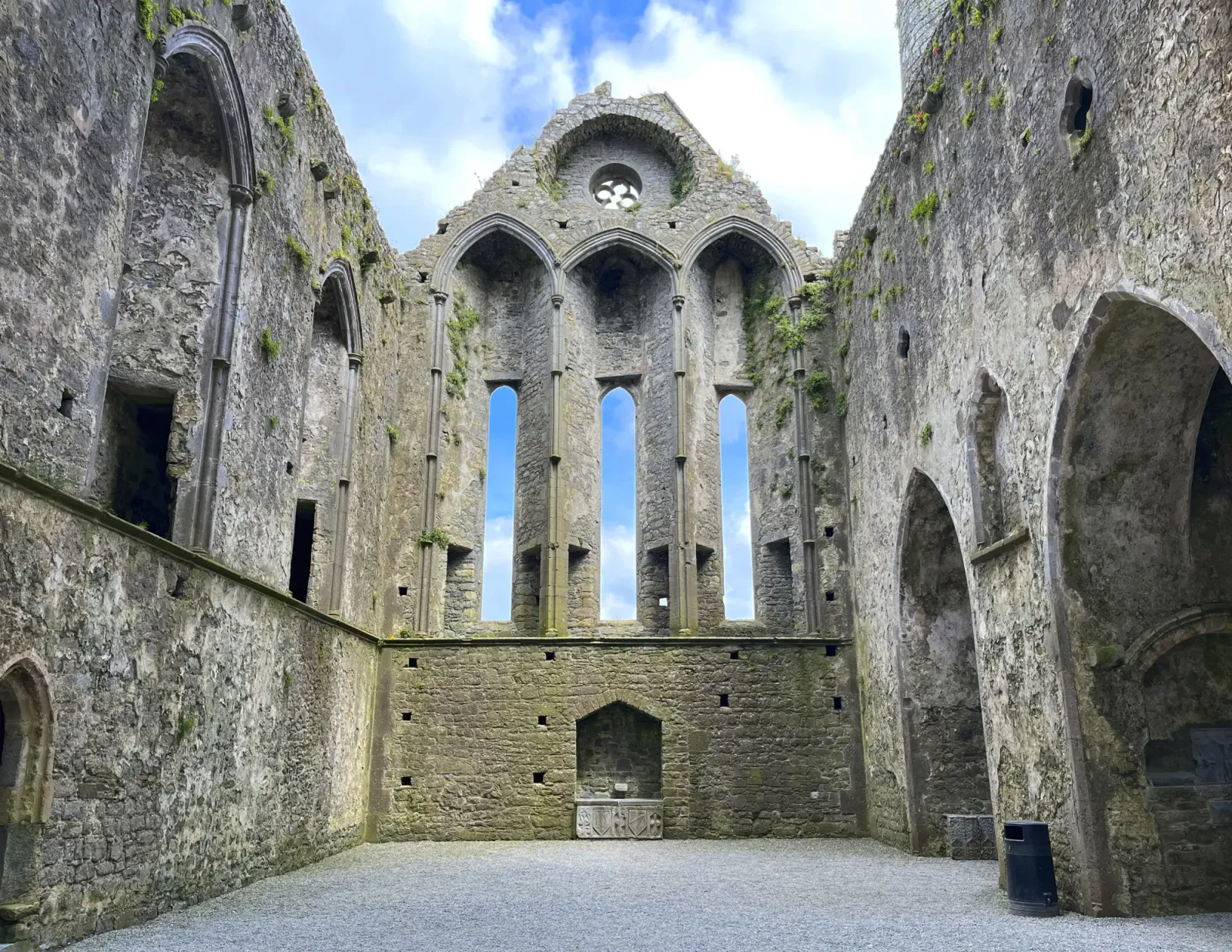 Rock of Cashel Church by Mrs. Wanderer Stone arches in the ruins of a church