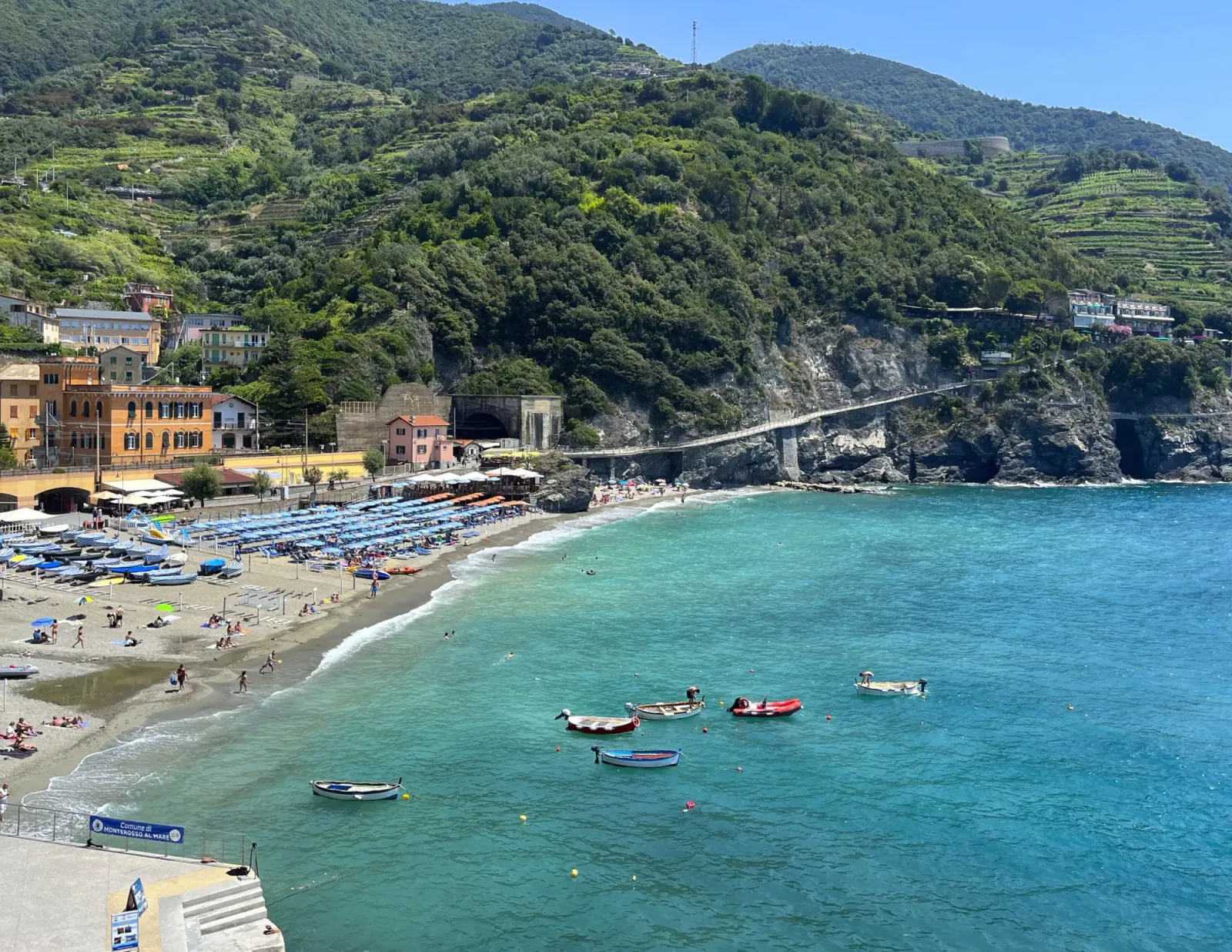 Monterosso by Mrs. Wanderer View overlooking the water and boats surrounded by terraced mountains