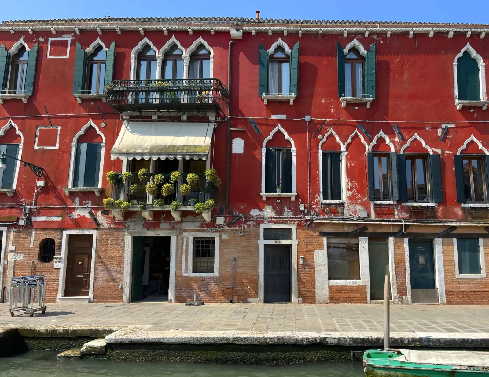 Burano Red Homes by Mrs. Wanderer Red facade on the canal