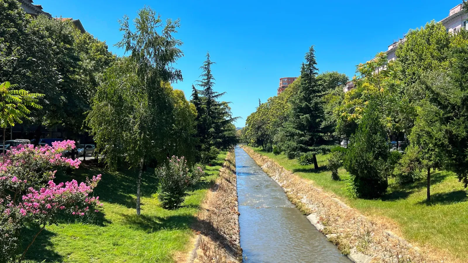 Lana River by Mrs. Wanderer Water in a canal flowing between trees