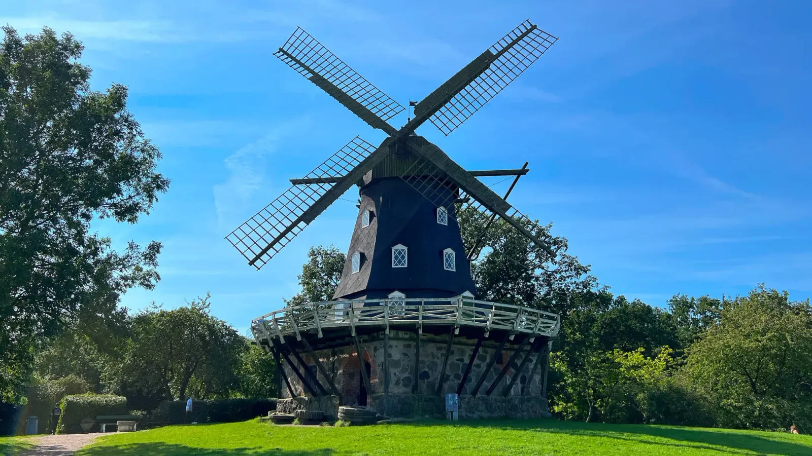 Malmö Slottsmöllan by Mr. Wanderer Wooden windmill on a green hill