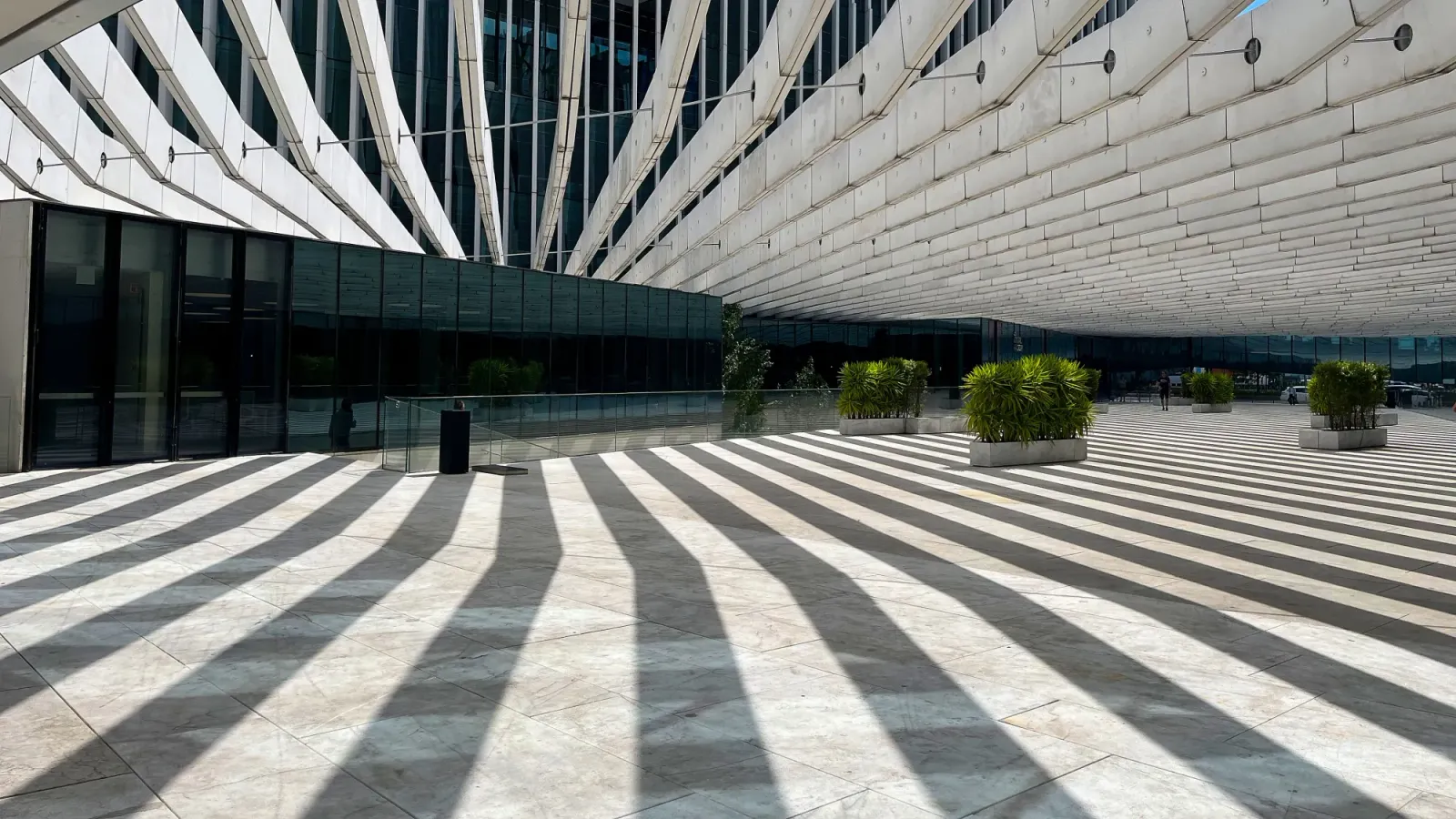 Porto Architecture by Mrs. Wanderer White striped ceiling casting a striped shadow over the courtyard