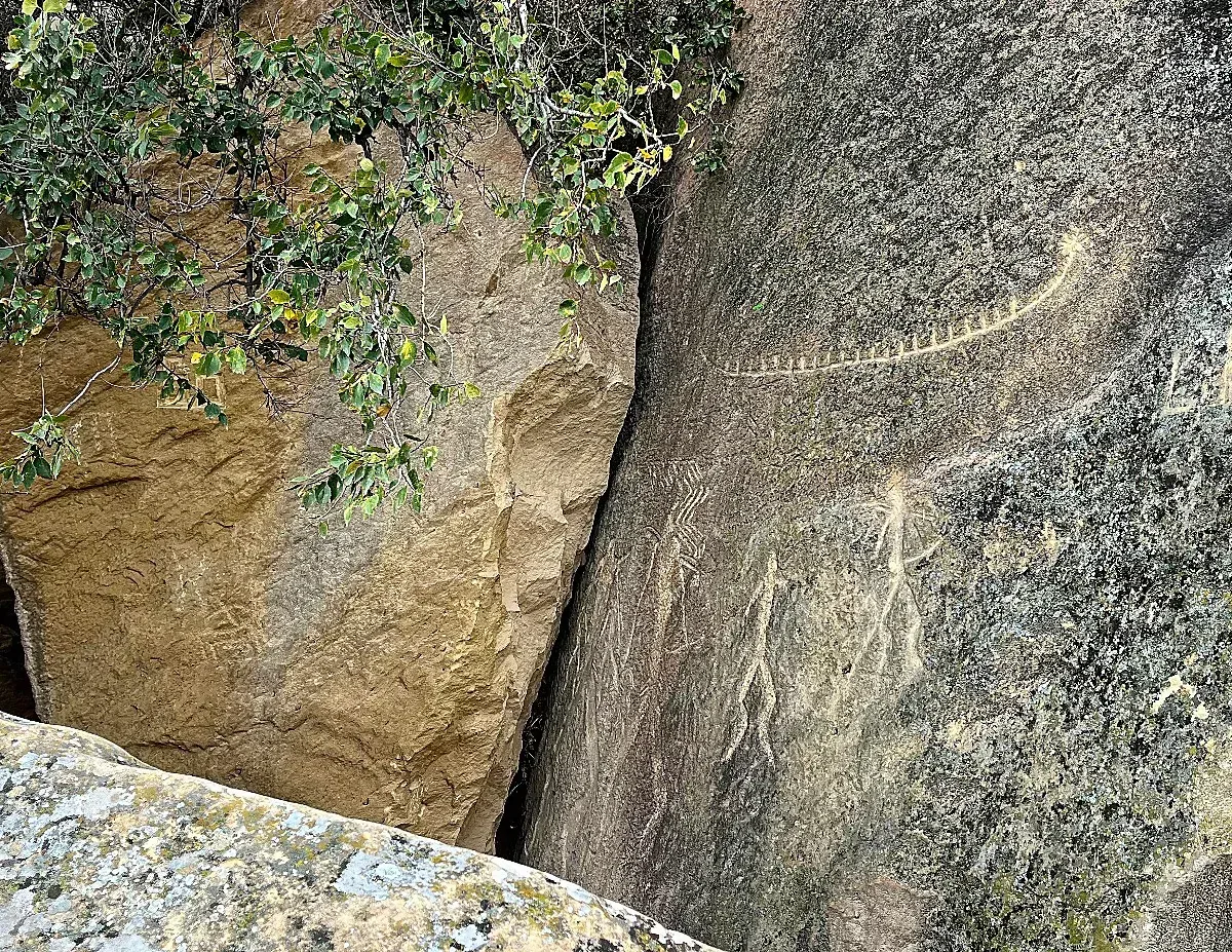 Gobustan Petroglyphs by Mr. Wanderer Sandstone rocks with carvings of people and a boat etched in them