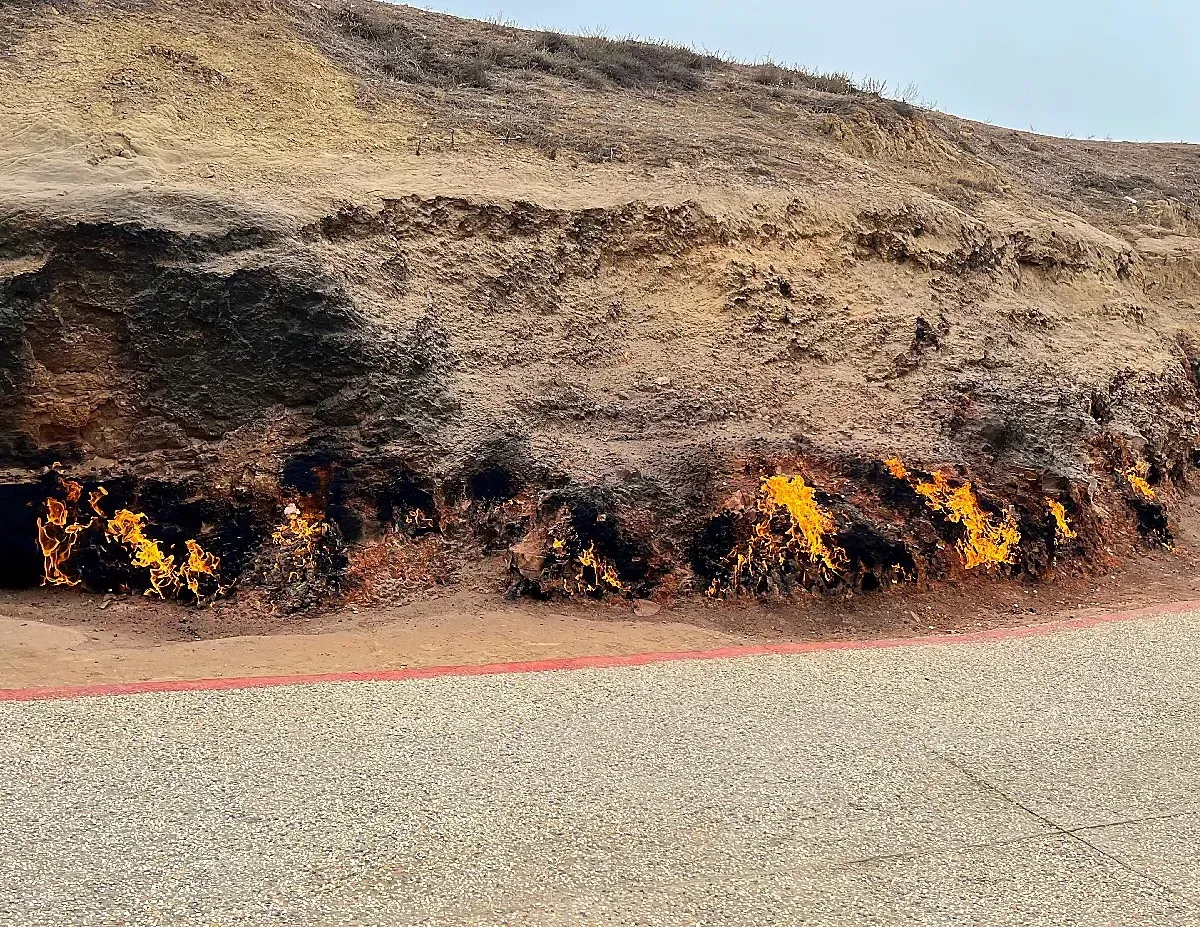 Yanar Dagh by Mr. Wanderer Brown hillside in flames from unseen gaseous fuel