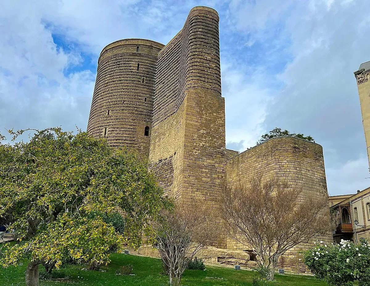 Maiden Tower by Mr. Wanderer Stone Tower set against a cloudy sky