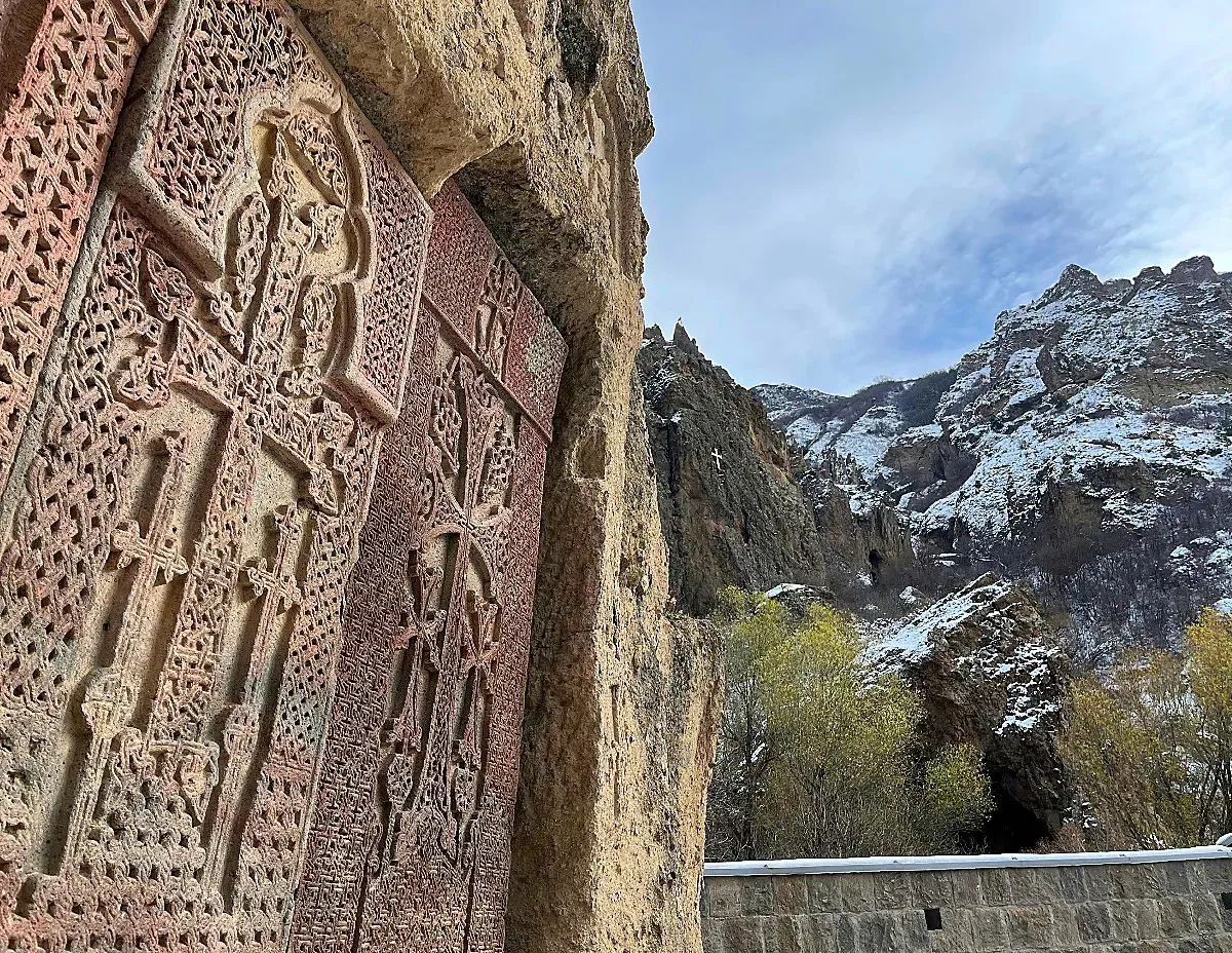 Geghard Monastery Crosses by Mr. Wanderer Ornate crossed carved into the side of a stone building