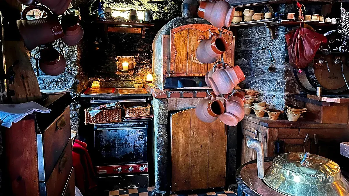 Tallinn Tavern by Mrs. Wanderer Stone tavern with wooden fire place and other clay and whicker bibs and bobs