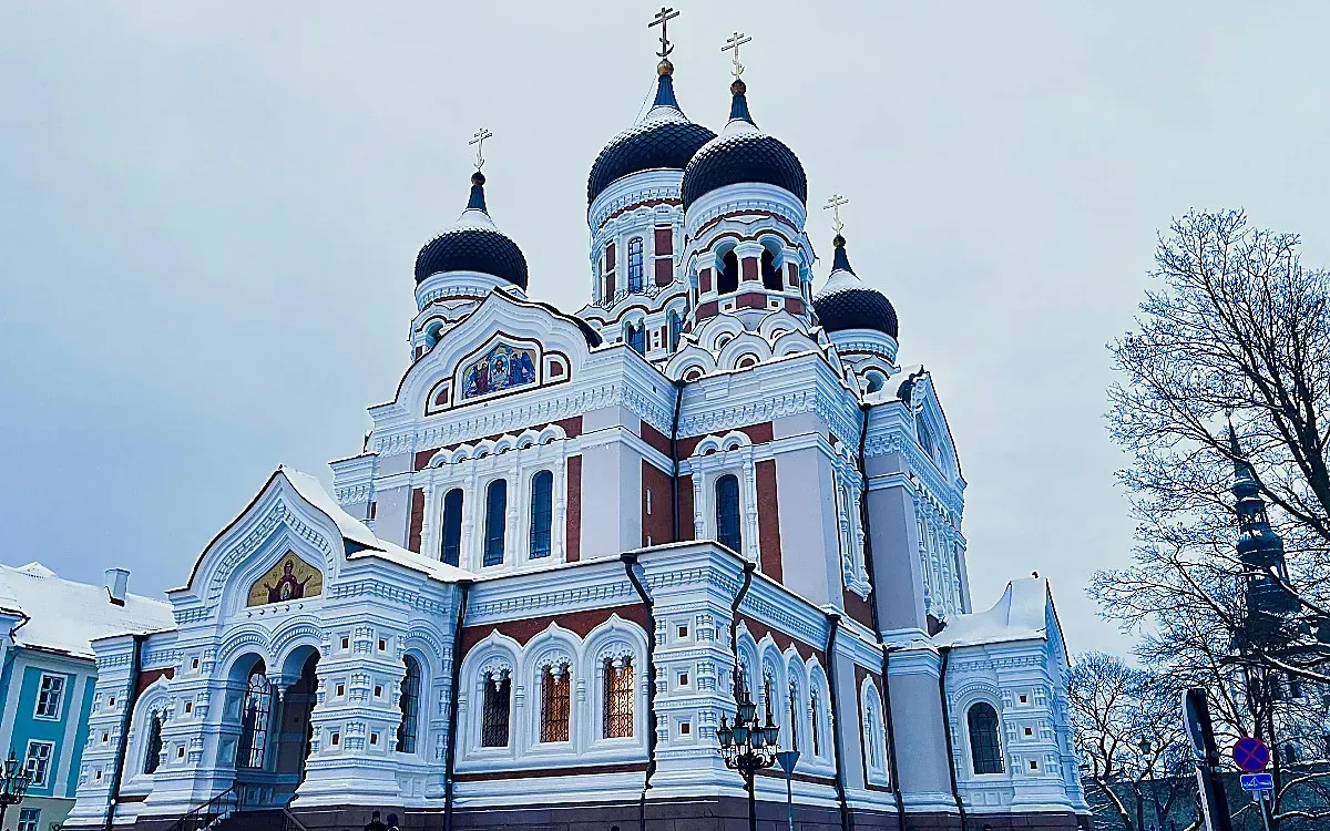 Alexander Nevsky Cathedral by Mrs. Wanderer Snow-dusted church with black onion domes and stained glass