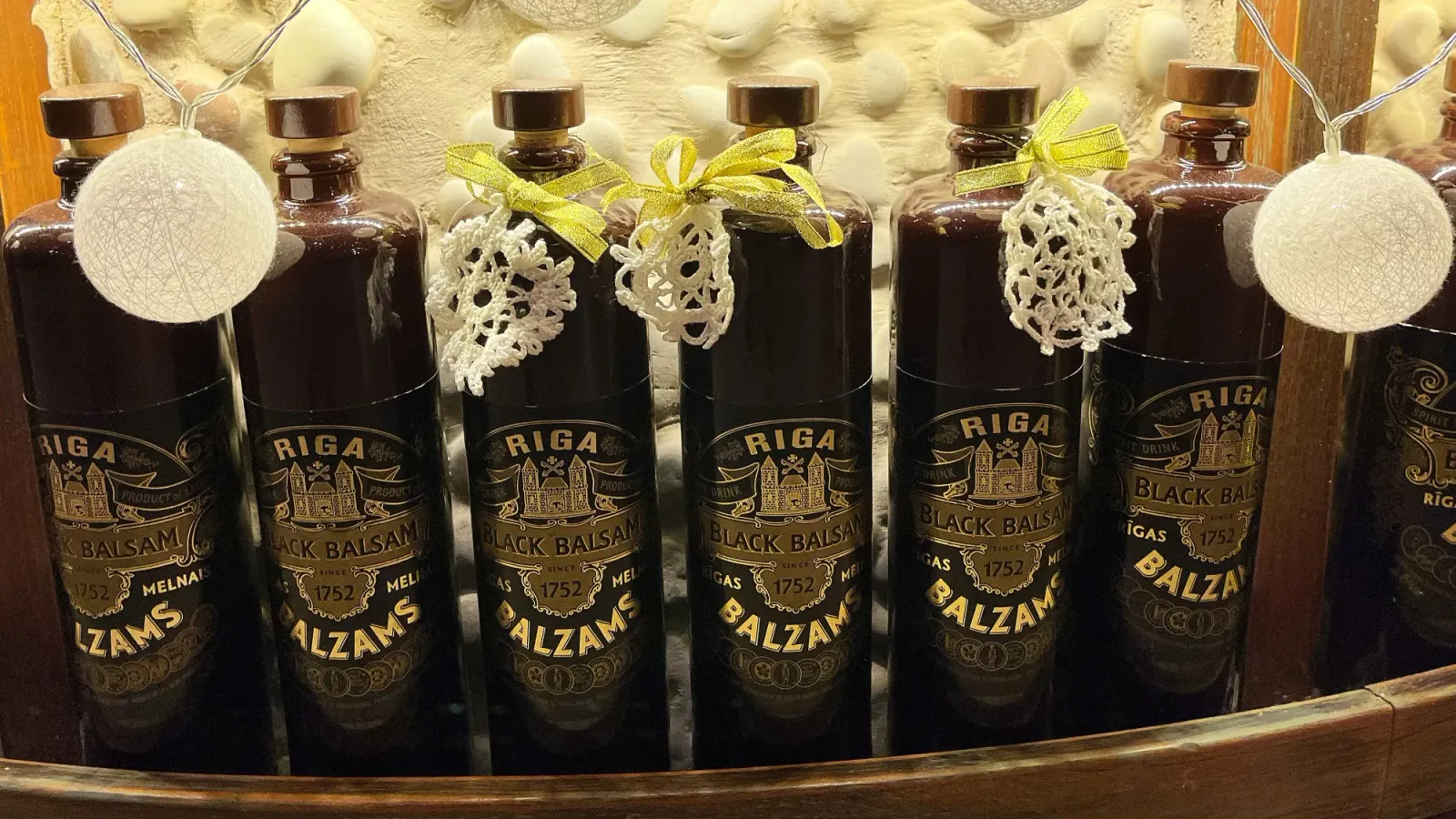 Riga Black Balsam Bottles by Mr. Wanderer Black bottles with lace doilies