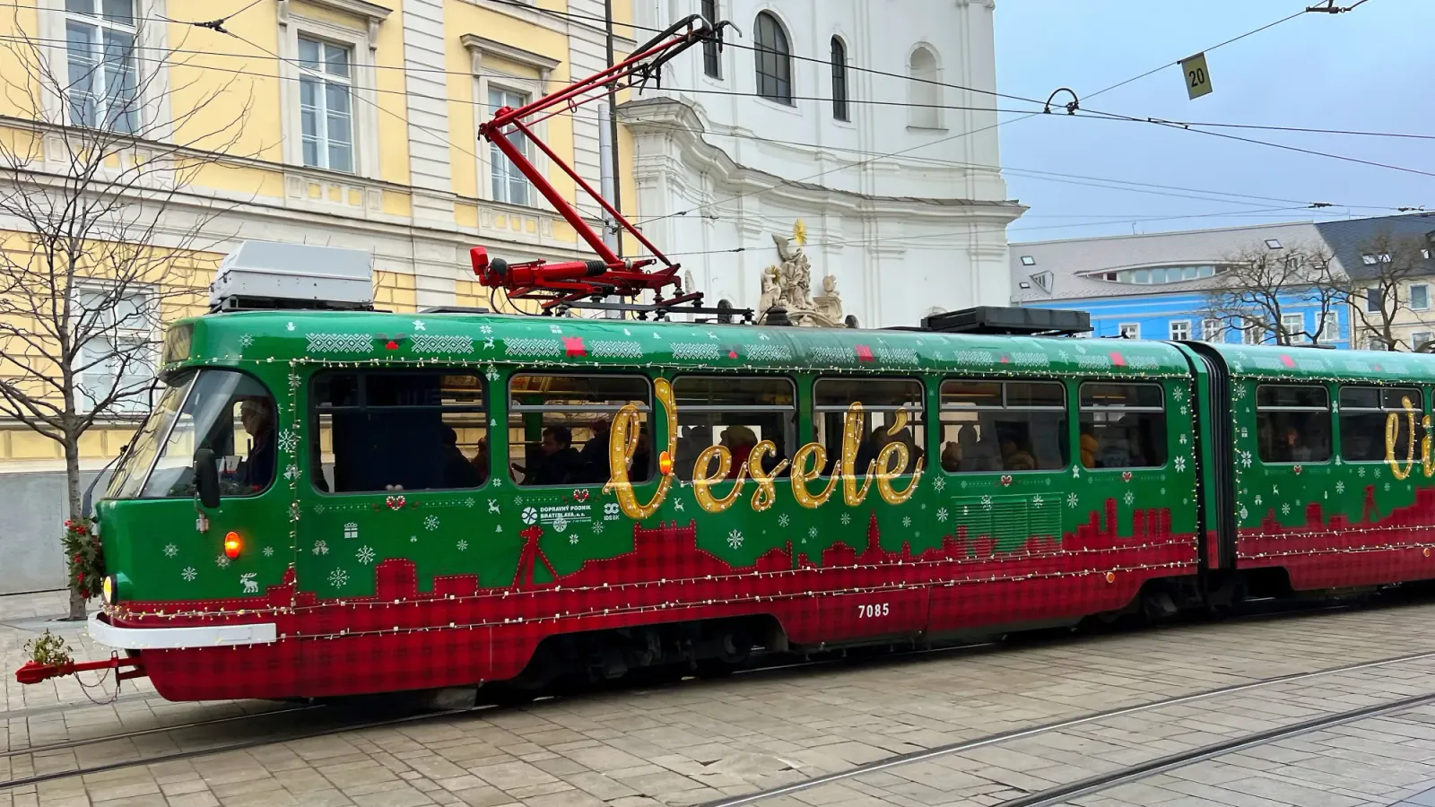 Bratislava Christmas Tram by Mr. Wanderer Green and Red checked tram car with golden lettering