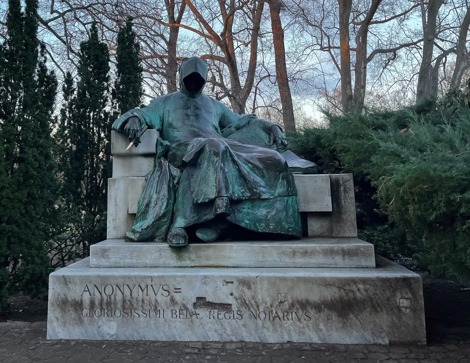 Anonymous by Mrs. Wanderer Eerie green statue reclining in a throne with a pen and notebook, and a hood covering their face