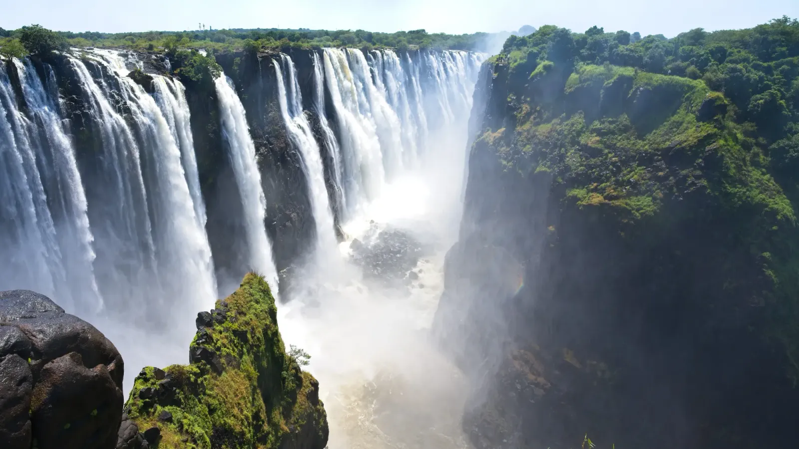 Zambia/Zimbabwe Falls by Mr. Wanderer Flowing water into the misty depths