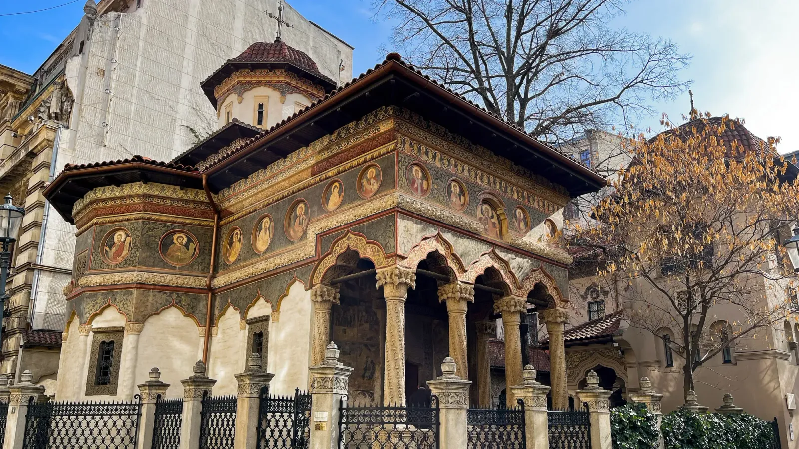 Old Town Bucharest by Mr. Wanderer Ornate church complex with stone columns