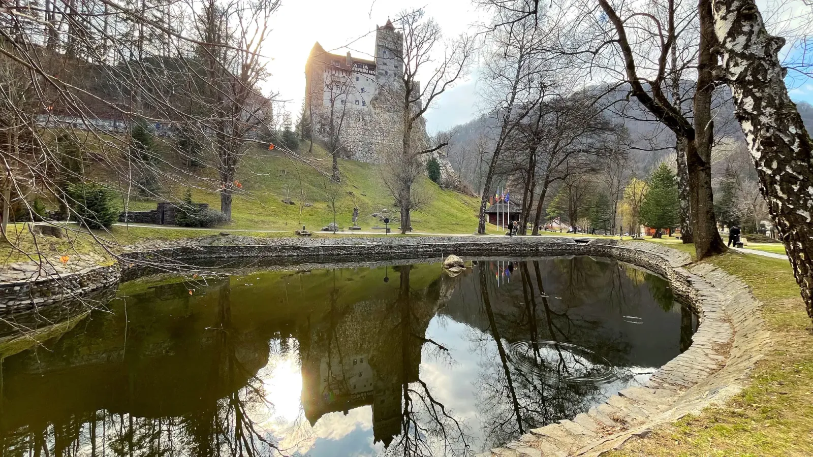 Bran Castle by Mrs. Wanderer Stone castle reflected in a pond