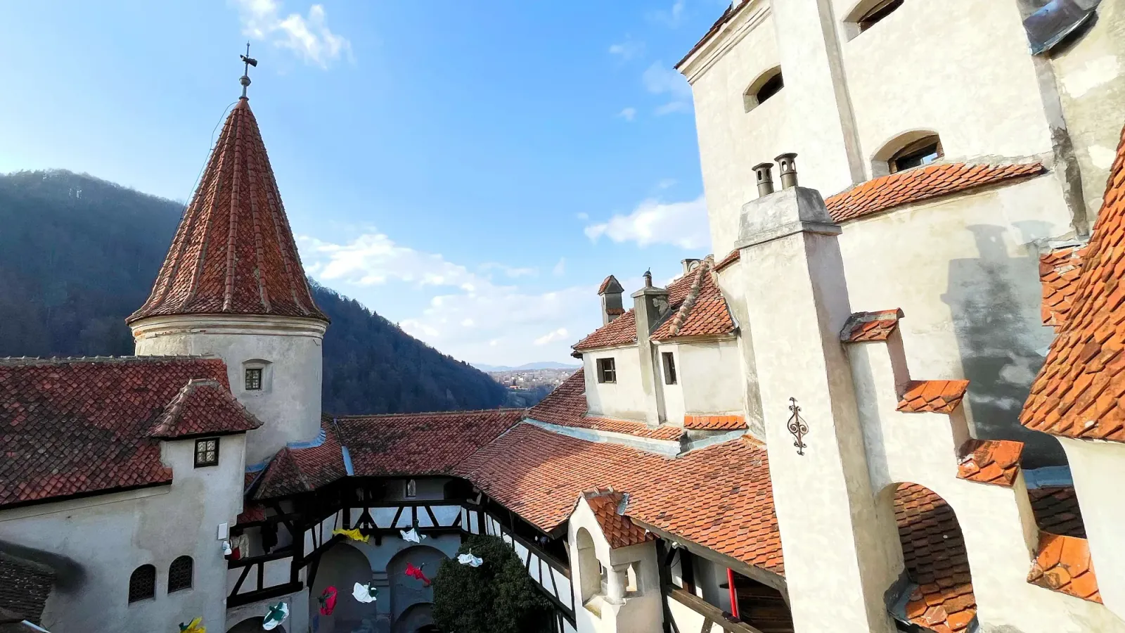 Bran Castle Courtyard by Mr. Wanderer Orange tiled roofs surrounding the top of the castle