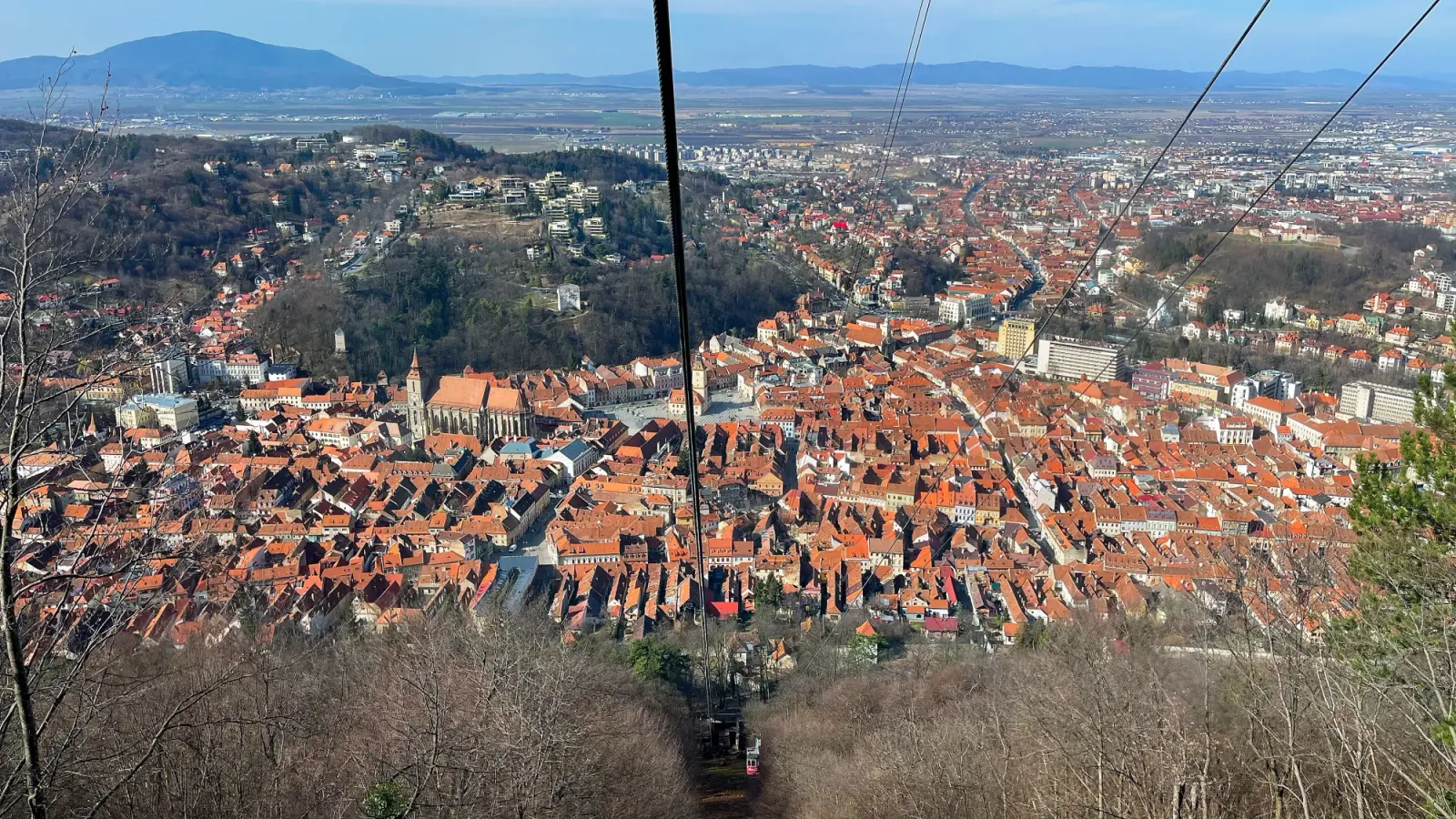 Brașov Cable Car by Mrs. Wanderer Birds-eye view of the orange roofs in old-town Brașov