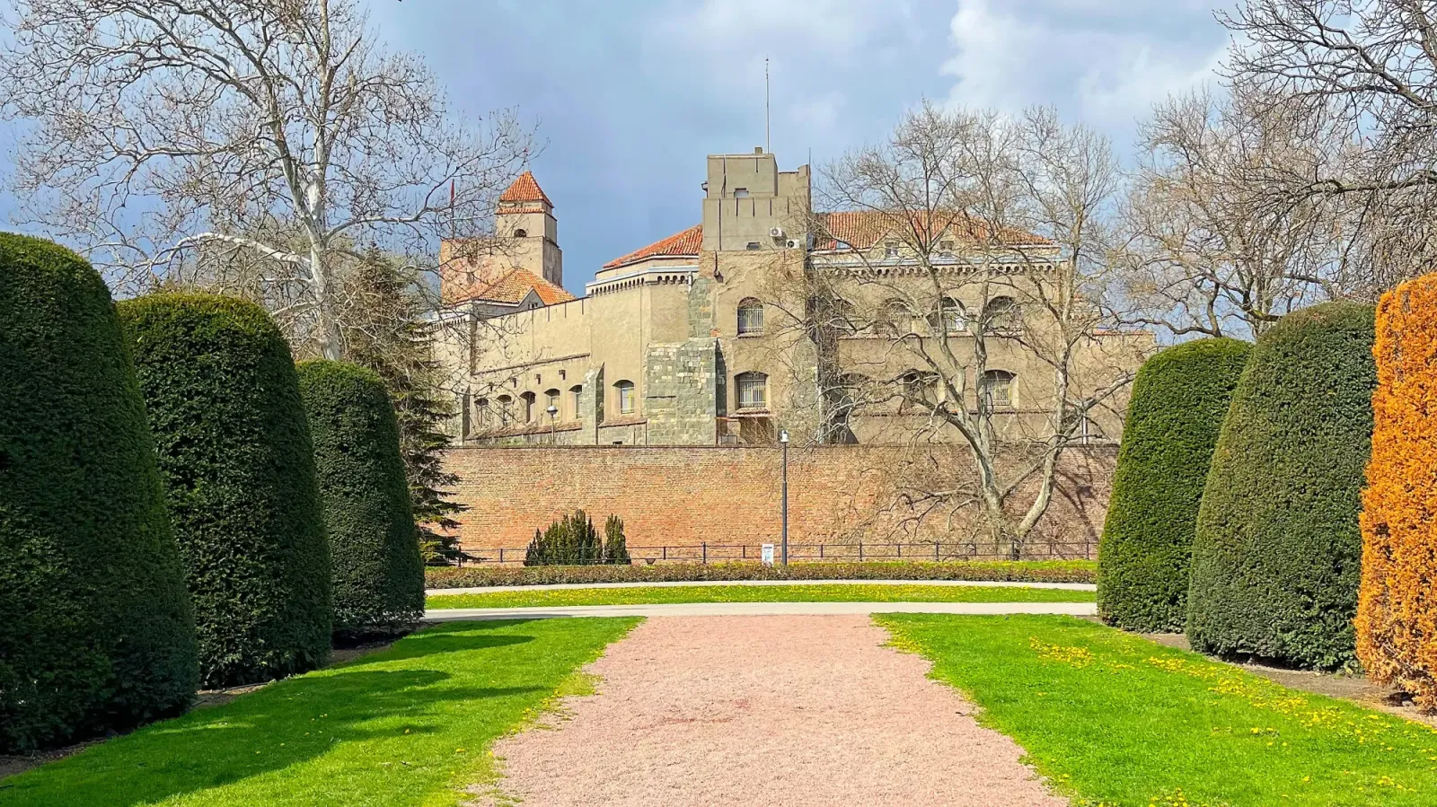 Belgrade Fortress by Mrs. Wanderer Stone fortress set behind a wall and framed with conical hedges