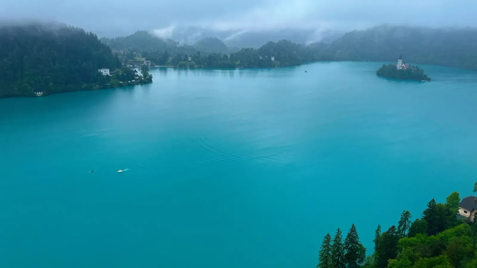 Misty Lake Bled by Mr. Wanderer Turquise water with a small island in the center of it
