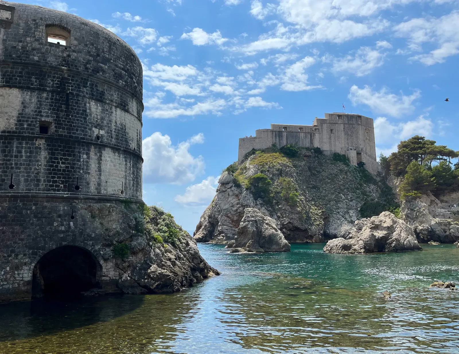 Fort Lovrijenac by Mr. Wanderer Stone walls and a fortress surrounding a sea bay