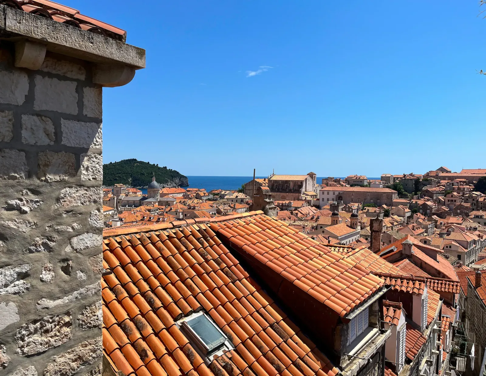 Dubrovnik Old Town City Skyline by Mr. Wanderer Orange roof tiles across the city looking out over the blue sea