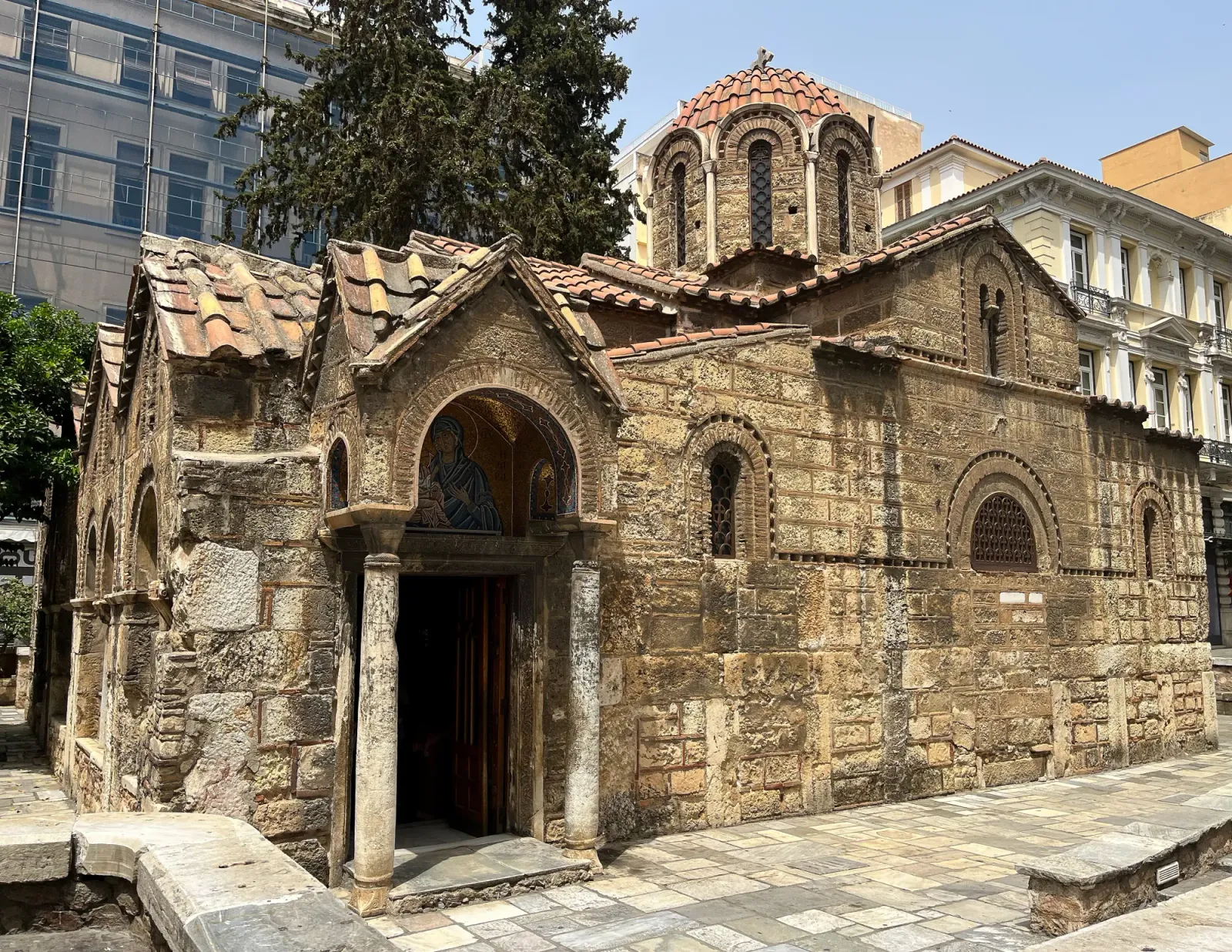 Kapnikarea Church by Mrs. Wanderer Stone church in the middle of the pedestrian pathway